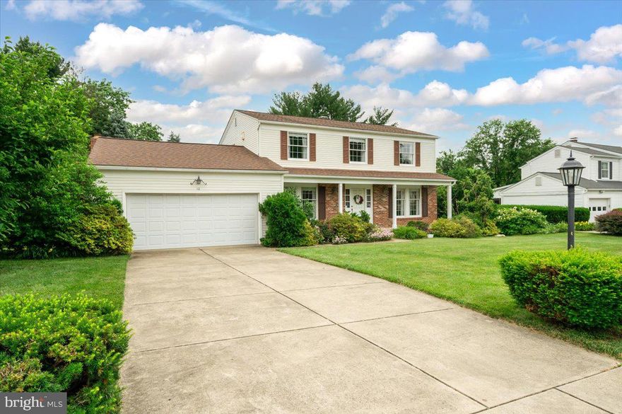 Spacious Baltimore County colonial with all the original finishes. Covered front porch to bright tiled entry foyer.  Formal living room with crown molding and dining room with chair rail accents. Eat-in kitchen. Sunken family room off the kitchen with sliders that open to upper deck. Main level includes half-bath and laundry room with back door that opens to stairs to lower stone patio. 4 bedrooms upstairs include master suite with walk-in closet, dressing area, and full en-suite bath. Lower level includes playroom with pool table, extra freezer, extra refrigerator, plus a workshop and utility/storage room. Cement driveway to 2-car garage with attic. Green lawns and lush landscaping make this a wonderful place to call home.  Includes 1-year American Home Shield Warranty.