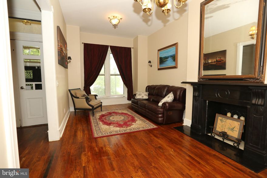 What a location!!! Nestled behind a quiet little park this historical masterpiece is  only a 5 minute ride from Penn Station.   3 bedrooms and 2 baths with updated  kitchen and  baths and parking.   The wide  open floor  plan on the first floor has gorgeous wood floors and historical trim work and  ornamental  fire places.  The kitchen is large enough for eat in but modern enough for the most decorated home chef.  Bedrooms are large, historical charm throughout, plenty of storage in the basement.  W/D in Basement.  2 Car tandem parking.