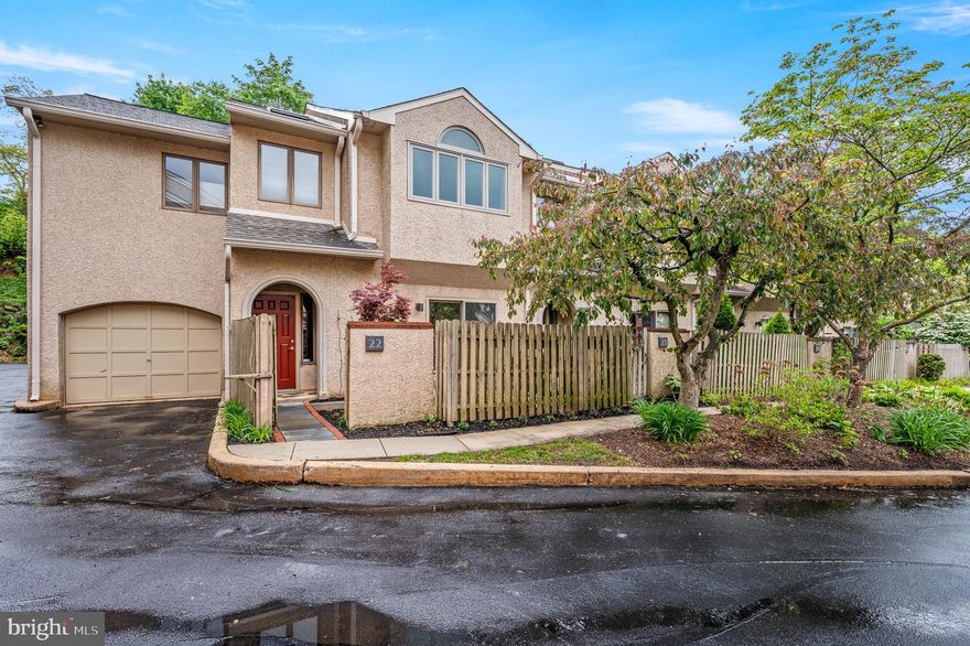 Welcome to this exceptional end-unit townhouse in the prestigious Greythorne Woods community, offering luxurious living that is just steps from downtown Wayne and the Radnor Trail. Spanning three levels, this home features warm parquet hardwood floors on each level. The first level features a gourmet kitchen with a cozy breakfast nook and built-ins, and an expansive dining and living area with a fireplace perfect for entertaining. The second level includes a primary bedroom with an en suite spa-inspired bath, a second full bathroom, a second bedroom, laundry, and a large open family room. The third level includes a spacious bedroom with remote-controlled Velux skylights. Vaulted ceilings, skylights, and crown moldings elevate the ambiance throughout the home. Recent upgrades include a high-efficiency HVAC system with heat pump and electric heating elements, 80-gallon electric water heater, Bosch dishwasher, and Speed Queen electric washer & dryer. Enjoy the convenience of an attached garage with direct entry to the home and an enclosed extra storage room. The front and back patios are serene outdoor spaces with mature plantings that are great for relaxation and entertaining. The low-maintenance lifestyle is enhanced by the association covering landscaping, snow removal, exterior maintenance, trash, sewer, and water. Located in the award-winning Radnor Township School District, this home is within walking distance of the train station, shopping, dining, movie theaters, Radnor trail, and parks. Explore the personalized website featuring a 3D Matterport tour, Virtual Reality Walkthrough, detailed floor plan, professional photography, aerial drone footage, and a community video (some photos digitally enhanced). Don’t miss this rare opportunity!