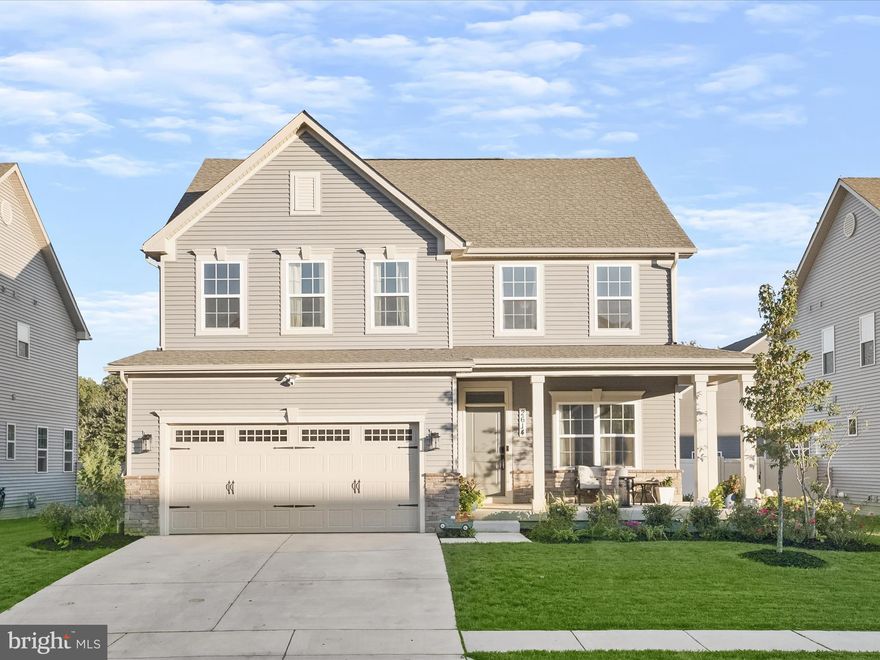 Introducing this four bedroom, three full and one half bathroom home built in 2022 by Ryan Homes in the Christopher Pointe neighborhood. The Columbia model offers over 4,000 square feet of thoughtfully designed living space, spread across three finished levels. A welcoming covered front porch greets you as you arrive, providing the perfect spot to relax outdoors. Inside, the flexible front living room can be used as a home office or additional lounge area. The open-concept main level is both stylish and practical, showcasing engineered hardwood floors and is flooded with natural light, creating a bright and airy atmosphere. The gourmet kitchen, a centerpiece of the home, boasts quartz countertops, a tile backsplash, soft-close shaker cabinets with under-cabinet lighting, a large center island, and stainless steel appliances, including a natural gas range. Adjacent to the kitchen, the dining area opens to the backyard through sliding glass doors, and the spacious family room is ideal for gatherings of any size. The main level also includes a half bath, pantry, storage closet, and access to the two-car garage with an EV charger outlet. Upstairs, the luxurious primary suite impresses, highlighting a tray ceiling with crown molding, a massive walk-in closet, and an ensuite bathroom featuring a walk-in shower with a bench, soaking tub, and dual-sink vanity. Three additional bedrooms, a second full bathroom with a tub shower, and a convenient laundry room with custom cabinetry complete the upper level. Downstairs, the fully finished lower level offers even more space for entertainment, featuring an expansive recreation room with a rough-in for a wet bar, a third full bathroom, and a utility room with ample storage. Outside, the backyard is fully fenced for privacy and includes a patio, perfect for everyone’s outdoor activities. The property backs to a retention pond, providing added privacy with no rear neighbors. Conveniently located off Berry Road/Rt. 228, with quick access to routes 301, 5, and 210 for commuting to DC. Just minutes away from everything you need with a variety of shopping, dining, and entertainment options. Sellers have an assumable VA loan with a 4.625% interest rate.