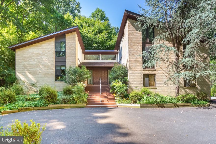 Stylish and private contemporary house on an acre in sought after Potomac Overlook community of McLean. This fabulous architecturally designed home has it all! Located close to the hiking trails of Scott's Run Creek. The home boasts cathedral ceilings with wood beams, open floor concepts, has 4 bedrooms, 3 and a half bath, an additional loft in one of the bedrooms and an office/loft area, above the living room.  On the main level you will find the poggenpohl gourmet kitchen, with ample eat in area and a family room. The Laundry room with additional storage and a full size freezer. The Magnificent living  room  adorned by a  wood burning fireplace, high ceilings . Entertain in the gorgeous dining room  located on the main level that opens to a secluded patio surrounded by trees. Take a few stairs up to  the  picturesque  inviting master suite with high ceilings with a balcony overlooking the pool,  it has a beautiful en-suite bath recently renovated and a walk-in closet. An additional bedroom with full bath on this level. A third bedroom with a walk up loft .You will also find a beautifully finished IN-LAW/ AU PAIR SUITE  on the lower level with a new kitchenette, a newly renovated bathroom and ample living space, that opens up to the gorgeous outdoor pool.  To relax, enjoy the many decks and entertaining areas in your private, secluded surroundings, overlooking mature vegetation and trees, or go for a swim in your very private pool, also comes with a pool house/cabana in your fenced in backyard. Ample parking with a two car garage and a circular driveway. Langley School Pyramid, Extraordinary location near Great Falls and, close to major commuting routes, tysons corner and close to airports and DC!  This is the Contemporary home you have been looking for, Come make it your Dream HOME!