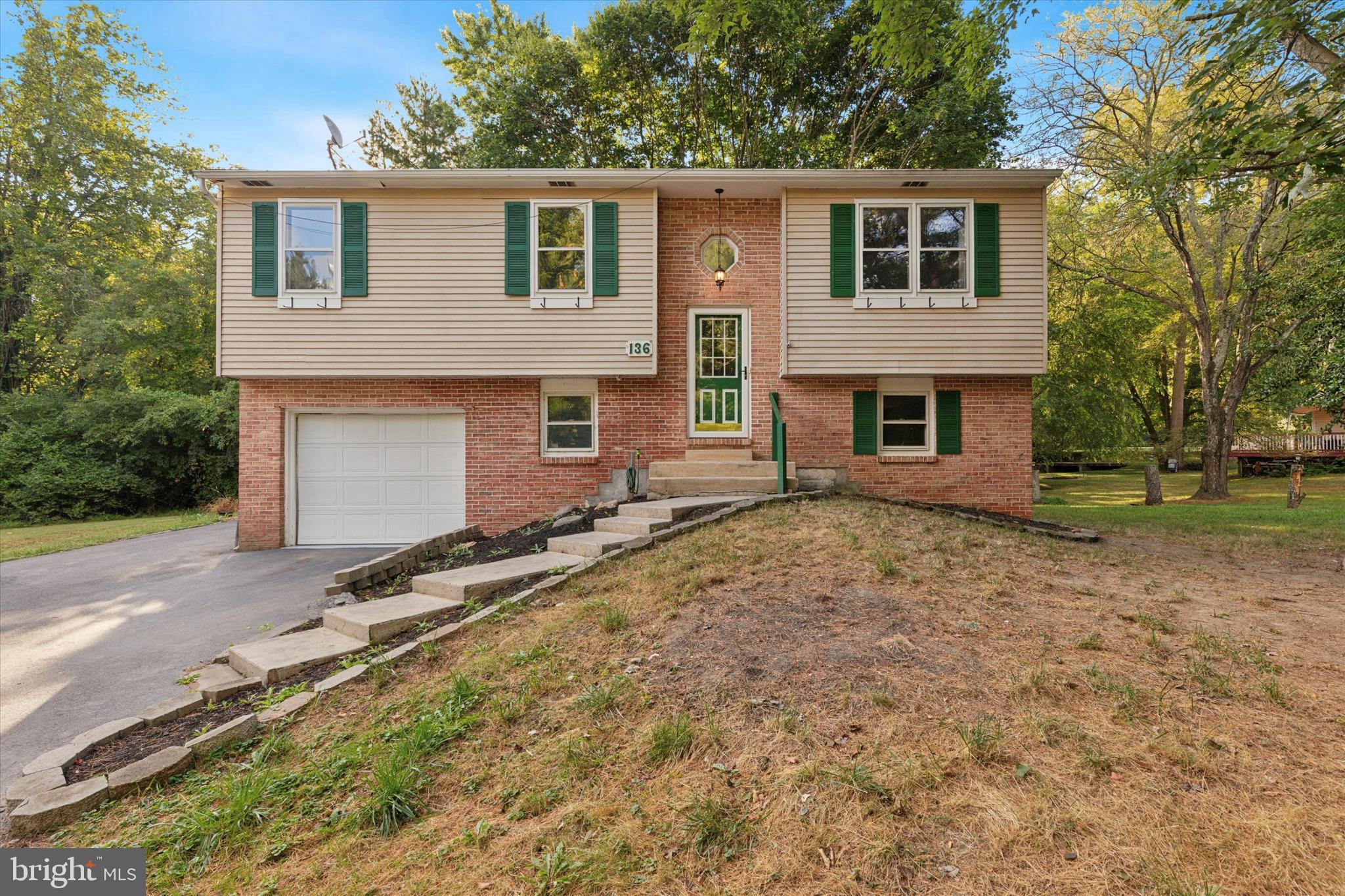 Detached and updated bi-level home tucked back in a small enclave of homes in the Borough of Downingtown is available for rent! The upper level boasts a bright living room featuring custom built-ins and brand new LVP flooring throughout. The dining area includes built-in cabinetry matching the living room built-ins. The kitchen offers plenty of counter and cabinet space. Three spacious bedrooms and a full hall bath with marble vanity round out the upper level. The lower level has brand new LVP flooring throughout, an updated powder room attached to the large finished family room, and sliders leading to the rear deck. The property has a large private rear yard with extensive landscaping and mature trees to complete the parklike setting. The large attached garage offers a workshop area and storage options, in addition to the spacious attic. The entire home has been freshly painted. Located within minutes of all major routes and in the award-winning Downingtown School District.