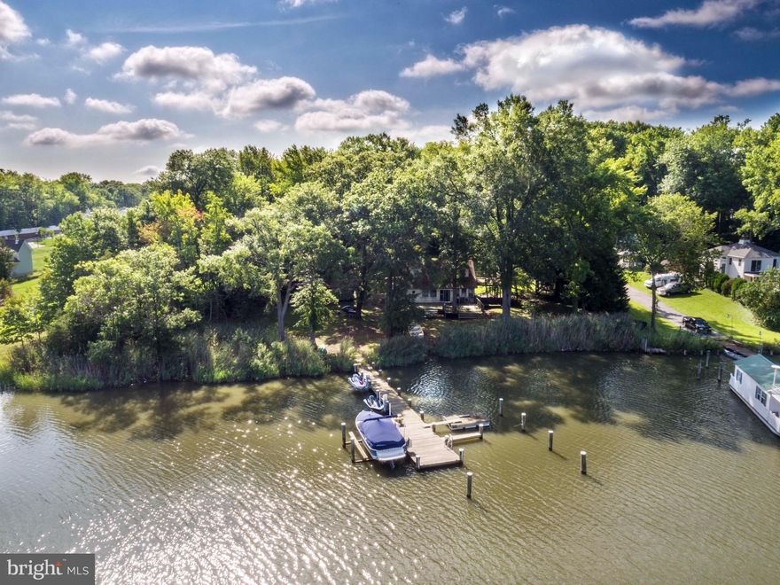 Fantastic private 1.9  acre lot--over 200' of Riparian waterfront, existing pier, boat and jet ski lifts.  Flat level lot--great views. To Be Built--Open floor plans--walls of glass--too many upgraded standard features to list. Meet with builder on designs and selections.  Photos are representative of Builder's work. Visit Whitehall Building for more information.  Existing cottage to be removed