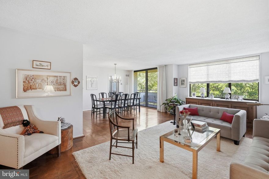 Welcome to this spacious 2 bedroom apartment with high end appliances including an in-home washer/dryer.  
The kitchen has room for a breakfast table.  It has luxury vinyl flooring and a pantry.  Lots of cabinets and a large granite counter.  The cook’s kitchen has a Whirlpool microwave and dishwasher, and Frigidaire stove and refrigerator (with ice maker).  There are oversized windows throughout the apartment with an amazing view of a gorgeous grove of trees just outside the window.   The second bedroom is on the opposite side of the apartment from the primary bedroom.  Off the dining room is  a balcony, sitting in which feels like being in a tree house.   The large walk-in closet in the foyer houses the washer/dryer.  There are 2 other closets in the foyer.  The bathroom has been renovated.  It has a beautiful walk-in shower and a large sink cabinet with a number of drawers.  The primary bedroom also has a large walk-in closet. The building has so many amenities, it lives like a resort. The lobby is in the process of a complete renovation.   The recently redecorated Arcade level has the state of the art fitness center with indoor pool and hot tub: locker rooms with showers and sauna.  Also in the Arcade is Chef Tony’s restaurant (a well known seafood/Italian eatery), a grocery store/deli, dry cleaners, travel agent, beauty salon, resident lounge, party and conference rooms.  There is a large outdoor pool with adjacent grills.  Tennis (lighted courts) and pickelball have their own building as you drive onto the property.  Ping pong is played regularly, as are social activities such as “Breakfast at Wimbleton”.  There are too many activities to mention them all.  A few are …trivia night, open mike night, monthly first fun movies, lectures, vaccinations, vote in all elections in the party room (including Presidential).  There is meditation, exercise class, book club, canasta, bridge, and mahjong.  We have wine and cheese get togethers in the lobby, a rocking New Year’s Eve party and various other celebrations.  We have car charging stations, and a car washing area with a dynamite vacuum.  Garage parking comes with the unit.  The space that comes with this apartment is just 10 steps from the elevator lobby.   It is easy to get to the Red Line Medical Center metro stop at NIH/Walter Reed.  The bus comes to the door of the Promenade.  Close to 495 and 270.  Nearby Wildwood Shopping Center has Balduccis, CVS, Bethesda Bagels, Starbucks, a number of places to eat and several cute boutiques.  Giant food is just across the street.