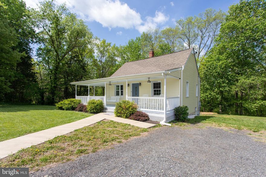 **BACK ON THE MARKET - BUYERS HAD A CHANGE OF HEART*** MULTIPLE OFFERS RECEIVED. 
 SELLERS WILL REVIEW OFFERS ON SATURDAY MAY 10TH AT 10:00 AM.  PLEASE SUBMIT ALL OFFERS BY 9:00 AM SATURDAY MAY 10TH**Welcome to your private retreat nestled on 5.53 serene acres in beautiful La Plata! This charming 3-level Cape Cod offers the perfect blend of comfort, character, and modern updates. Step onto the expansive covered wraparound porch—ideal for sipping your morning coffee or watching the sunset in peace. Inside, the original hardwood floors add warmth and timeless appeal throughout the open-concept main level, where the living space flows seamlessly into the updated kitchen, perfect for entertaining or everyday living. Upstairs, you'll find a spacious primary loft suite featuring generous closet space and a full ensuite bath, creating a tranquil haven to unwind. The lower level provides added flexibility for storage, hobbies, or potential finishing. This home features 2 bedrooms and 2 full bathrooms, including modern kitchen and bath updates completed in 2021. Major system upgrades include a new septic tank, new thermostat, and a new refrigerator for your peace of mind. Whether you're seeking quiet country living or a place to grow and relax, this property offers it all—space, charm, and convenience.