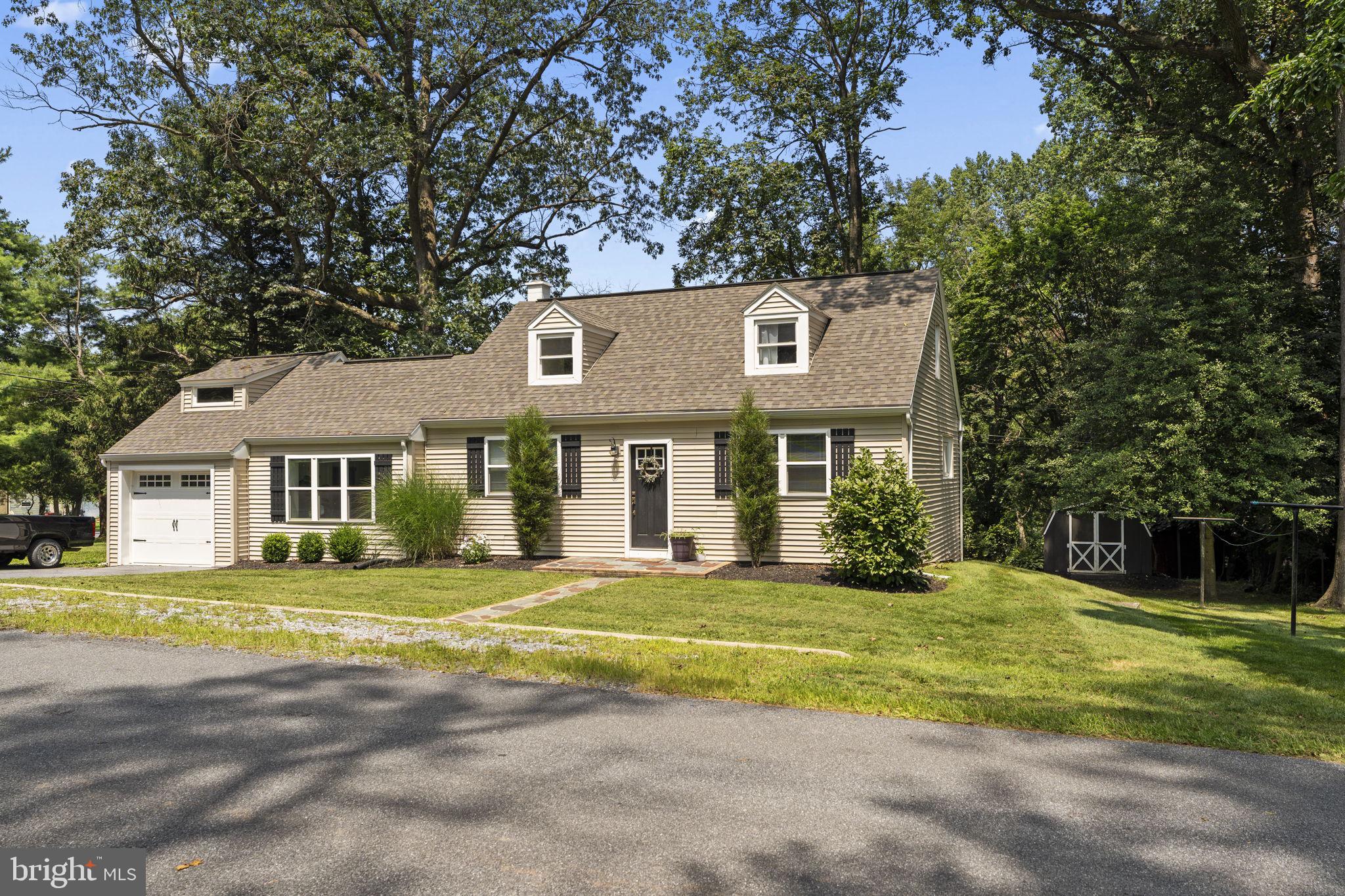 Welcome to 261 Park Ave in charming Lititz, PA! This classic Cape Cod sits on a spacious 0.55-acre lot with mature shade trees. The home features 4 bedrooms—2 on the main level and 2 upstairs —plus a full bathroom on the main floor for easy access. Inside, you'll find an open kitchen, dining nook, and living area complete with an island and a large bay window that fills the space with natural light. The neutral, modern paint palette provides a fresh and inviting feel throughout. Radiant floor heating and a heat pump offer efficient year-round comfort. Outside, enjoy the peaceful, shaded brick patio and spacious backyard, perfect for relaxing or entertaining. Additional highlights include a 1-car attached garage, utility shed, washer/dryer hookup, and a full basement offering plenty of storage. With a desirable Lititz location close to local shops, parks, and schools, this home is ideal for families, first-time buyers, or anyone seeking comfort and convenience in a charming small-town setting. Schedule your private showing today!