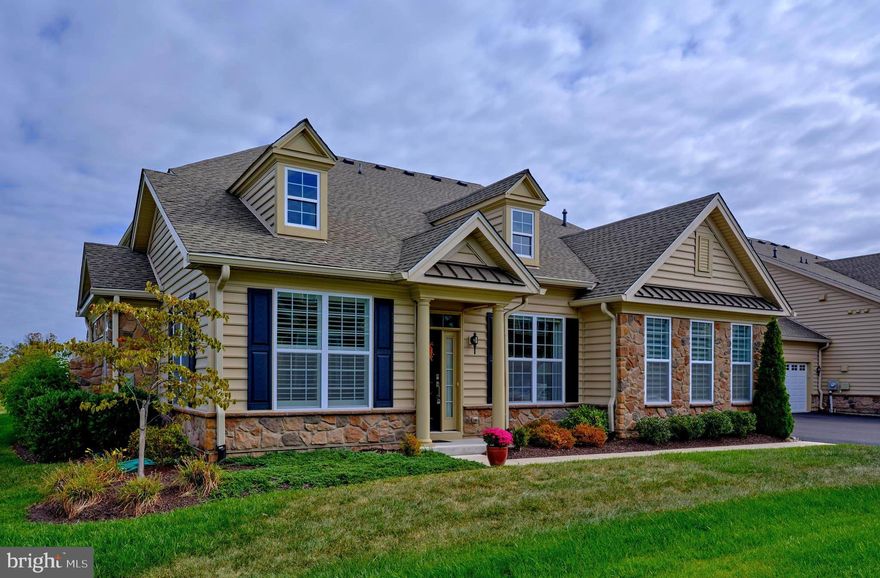 Welcome to 3267 Bushwood Drive.   Built on a premium lot, this residence is arguably, in one of the lovliest locations in the resort style Community of Regency at Hilltown.  Enjoy spectaular sunsets with unobstructed panoramic views of lush green pastures and magnificent long distance vistas. 
This masterfully crafted Darin Manor House Model blends luxurious design with the comfort and convenience of modern day living.  The seemless blending of the open concept floorplan allows the natural light to fill the space and keep the rooms open and welcoming. The beautiful living room and dining room with exquisite chandelier,  souring vaulted ceiings, and gleaming hardwood floors,  create a lovely and elegant space.  Open and charming and perfect for entertaining. The spectacular chef-inspired kitchen also designed to compliment entertaining with huge center island, all high-end appliances,  white farmhoue style sink, upgraded countertops, upgraded fixtures and cabinets, crown molding and oh, so much more! The casual dining area  gives easy access to the patio, offering stunning views to help  bring the outside in while grilling, or spending a relaxing evening,  enjoying nature and a picturesque view. To add to the comfort and privacy on the patio  there is an exterior advanced awning and privacy fence.
Spend time in the adjoining cozy great room with a lovely upgraded gas fireplace and a  light filled living space,  just perfect for casual gatherings, while again, taking in the delightful view. 
The spacious office/den has custom built in cabinets, inspiring views  and classic french doors for privacy.
The main floor  primary suite offers a peaceful retreat boasting a tray ceiling, two walk in closets, custom  window drapery panels and impressive  Hunter Douglas motorized shades,. The luxurious primary bath offers dual sink vanities, large walk-in ultra shower, custom tiling and private commode. There is also a well appointed and lovely powder room. With convenience being paramount, to complete the first floor, there is the main floor laundry, mud room,  storage closets, coat closet,  and  access to the overized two car garage,  just off the kitchen.
Travel up the classic turned staircase to the remarkable and versatile loft area with cathedral ceiling with plenty of space for projects, a studio or media room.
There are two perfectly positions bedrooms, large closets, plenty of storage space,  and a convenient  elegant full bath with soaking tub and shower.
The location was chosen to take full advantage of the quintessential Bucks County countryside views and surrounding natural beauty.  The interior was thoughtfully reviewed and designed with upgrades including everything from exquisite chandeliers to upscale custom window panels, elegant and functional Hunter Douglas motorized shades, shutters and blinds. The orginal designs were revised to add an additional bedroom to offer more room for guests.  Even the electrical elements were upgraded. like scalloped high hats and dimmer switches.....just to mention a few.  It  is obvious that this was a labor of love and has been meticulously kept. The unparralleled ammenties include, an 11,0000 sq ft club house with a state of the art fitness center, outdoor pool,  pickleball courts, bocce, scenic walking trails and so much more! Enjoy low maintenance living with services that include snow removal to your front door,  lawn care, and maintenance of all common areas. All of this allowing you to enjoy your active life style and have more time to  spend doing the things you love.  Located 10 minutes from Doylestown and the charming historic  town of Perkasie. So close to fine dining, theatres, galleries and a host of cultural activities. 
.