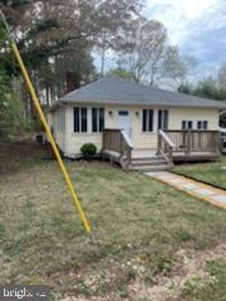 Water access home with 3 bedrooms and 1 bath with laundry closet. Laminate flooring for easy of cleaning and pet friendly throughout much of the home. Level yard with big shed in back with 2 sides to store kayaks or other fun equipment for warm weather use. Patio in back and large clear side yard for volleyball or bocce ball or even corn hole. Make your plans now to come and see and make it your own retreat! Owner will sell most of the furnishings with the purchase. Call for details.