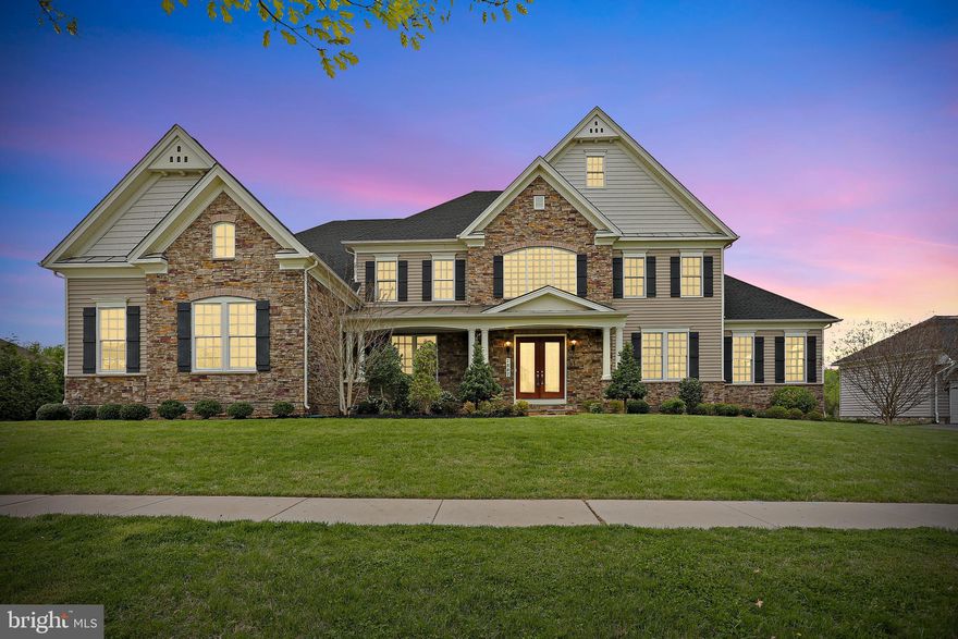 Welcome to 2847 Seabiscuit Dr in sought after Trotters Glen! Nestled in a prime, convenient location, this spectacular home offers an unmatched living experience with its grand scale and exquisite finishes. Boasting four generously sized bedrooms and six full bathrooms and more than 9,000 square feet, this property is a testament to upscale elegance.  Be greeted by a stunning two-story foyer, flanked by a breathtaking dual staircase, setting a majestic tone from the moment you step inside. The main level features a sophisticated dining room and a formal living room, perfect for hosting guests. The two-story family room, complete with a cozy fireplace, offers a dramatic space for relaxation and social gatherings.   Adjacent to this, the chef's kitchen is a culinary dream, equipped with top-of-the-line appliances, ample counter space, and custom cabinetry—ideal for both elaborate entertaining and everyday meals. A charming breakfast room and light-filled sunroom provide additional spaces for casual dining and serene relaxation, overlooking the beautifully landscaped surroundings.  Upstairs, the opulent primary suite includes a fireplace, vast luxury bathroom with high-end fixtures, and two massive walk-in closets designed for the ultimate wardrobe organization.  There are three more generous bedrooms, each with its own en suite bath.  The partially finished basement offers a huge rec room and full bath while presenting endless possibilities for a home theater, gym, or additional living quarters according to your lifestyle needs.  Freshly updated with new carpet and paint, every detail in this home speaks to a bespoke living experience. Discover the true meaning of luxury and convenience in a home that's nothing short of spectacular.  Welcome to your new haven, where every day feels like a lavish retreat.