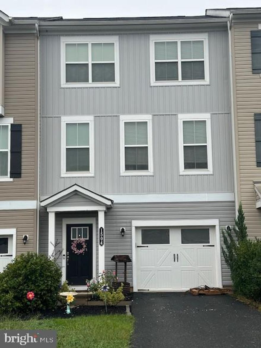 Location! Location! Location!  This beautifully maintained Colonial style townhome is only minutes from historic downtown Fredericksburg, the VRE, 95 and shopping.  Also an easy commute to Dahlgren.  This 3 level townhome with attached one car garage has over 2300 square feet of living space.  The open floor plan is great for entertaining with upgraded Engineered Hardwood flooring on the main level.  Beautifully appointed kitchen with stainless steel appliances, gas stove, beautiful quartz counter tops, an island and lots of cabinet space.  Walk out on the maintenance free trex  like deck that is the width of the home and enjoy  entertaining and grilling outside.  This townhome backs up to the woods adding more privacy then the townhomes that back up to one another.  Upstairs you will find 3 nice sized bedrooms including the primary suite.  The lower level gives you that extra space for whatever you desire ; a rec room, office space, craft space.   In the lower level, there is a half bath that is roughed in for you to finish as you would like.  There may be room for a corner shower.  Pictures will be uploaded prior to 10/04/24.