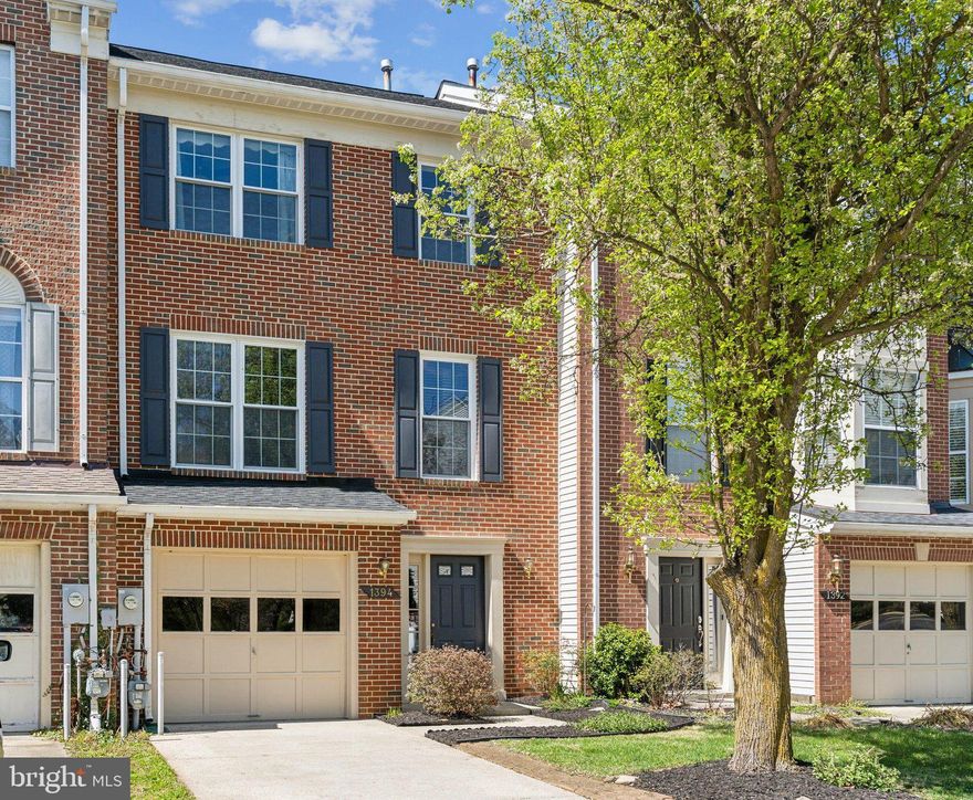 Beautiful Townhome in Waterford – Available Now! No pets, please. Welcome to this spacious, updated 3-story townhome located in the desirable, water-privileged community of Waterford! The bright and open main living area features stylish shiplap walls and low-maintenance luxury vinyl plank flooring throughout all three levels. The kitchen offers granite countertops, a large island bar, tile backsplash, and stainless steel appliances. The dining area is perfect for entertaining, with designer lighting and space for a full-sized table. Sliding doors lead to a private deck overlooking mature trees—ideal for relaxing or hosting friends.

Upstairs, the large primary suite offers vaulted ceilings and a private en-suite bath. Two additional bedrooms and a second full bathroom complete the upper level.

The entry-level features a single-car garage, a spacious bonus room with a cozy wood-burning fireplace, laundry, and access to a fully fenced backyard.

Waterford offers great amenities including a tot lot, community pier, and kayak rack. Conveniently located near shopping, dining, and with easy access to DC, Annapolis, and Fort Meade.
Ready for move-in as soon as you're ready—schedule your tour today!