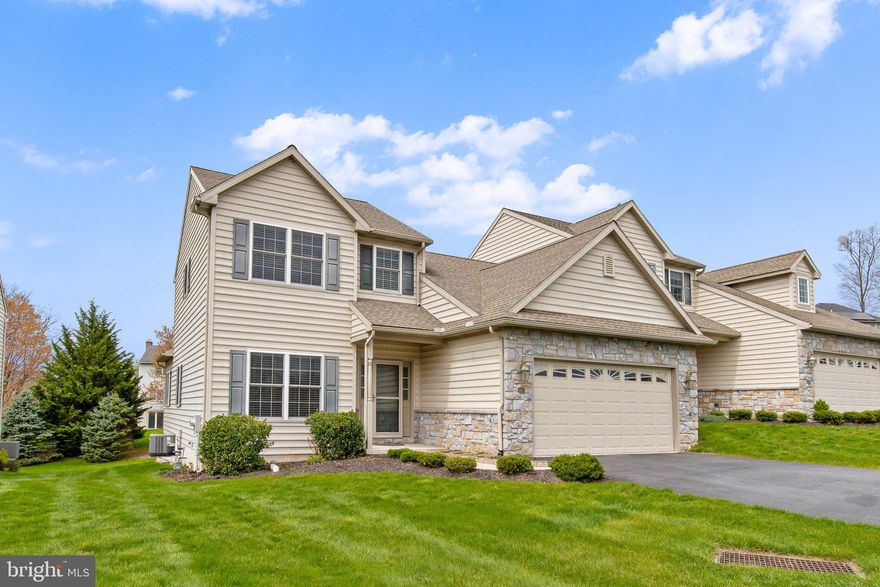 Nestled in the desirable Woods Edge community of Elizabethtown, this former model home seamlessly blends refined design with everyday functionality. Meticulously maintained and move-in ready, it offers a harmonious balance of comfort and sophistication.​ Upon entry, you're welcomed into a spacious living room adorned with gleaming luxury wood vinyl floors and a ceiling fan, creating an inviting atmosphere. The adjacent kitchen and dining area boast quartz countertops, a central island, pantry, recessed lighting, and a built-in desk with hutch—ideal for culinary endeavors and casual gatherings.​ A sunroom with a vaulted ceiling and a ceiling fan provides a serene retreat, perfect for relaxation or entertaining. The main level also features a primary bedroom suite with an en-suite bath, a convenient powder room, and a laundry room for added practicality.​ Upstairs, two additional bedrooms with walk-in closets and a full bath offer ample space for family or guests. The unfinished walkout lower level featuring daylight windows presents a blank canvas for your creative vision.​ Outdoor living is enhanced by a composite deck, as well as a patio equipped with a retractable awning, providing comfortable spaces for your enjoyment. A two-car garage with additional storage space completes this exceptional residence.​ Schedule your showing for this distinguished Woods Edge home today!