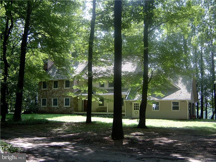Exceptional privacy and superior location are the hallmarks of Deerhaven Farm. The 30 acre farm is surrounded by large estates which are perpetually eased against subdivision and in the midst of Cheshire Hunt's "Tuesday Country". The 4BR, 2.1BA house has a formal LR, DR, FR & a large Master Suite. Equestrian amenities include 13 acres of fenced pasture, a lighted arena, and a 6 stall barn with wash stall and tack room. The farm enjoys long, protected views. Six acres of the farm is currently leased to a farmer and is in corn. The property cannot be subdivided although the easement allows for the construction of a guest house and an indoor arena.