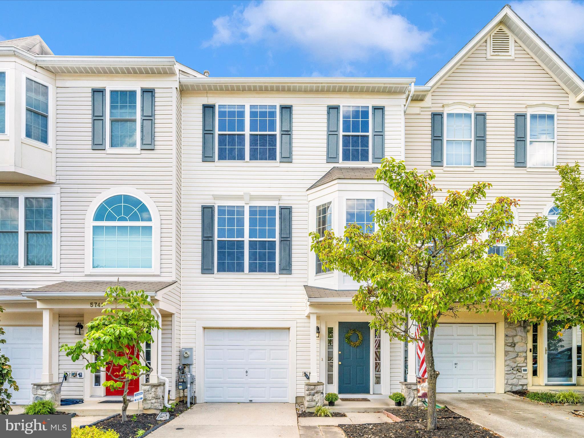 Come FALL in love with this beautiful townhome! The entry level welcomes you with a private 1-car garage, foyer, and a spacious rec room that walks out to a cozy under-deck patio. Upstairs, the open floor plan feels inviting and perfect for everyday living. You’ll find a bright living room, half bath, dining room, and breakfast area flowing into the kitchen. The kitchen shines with brand-new granite countertops and a pantry for extra storage. The French doors open to a large deck, perfect for relaxing or entertaining while enjoying peaceful wooded views. The top level offers 3 bedrooms and 2 full baths, including a spacious owner’s suite with a walk-in closet and a private en suite featuring a soaking tub, separate shower, and double vanity. Freshly painted with new carpet throughout—this home is truly move-in ready. Conveniently located near shopping, dining, entertainment, and major routes, with a low HOA fee to top it off!