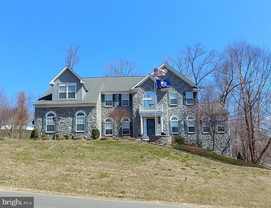 LUXURY ESTATE LIVING AT ITS FINEST ON 3+ ACRES! 6 BEDROOMS (1 ROOM NTC), 4.5 BATHS,  3 FINISHED LEVELS, 3 CAR SIDE LOAD GARAGE & OVER 5400 SQFT! SHOWS LIKE NEW, INCREDIBLE LANDSCAPING WITH JAPANESE MAPLES & CHERRY BLOSSOM TREES! EXQUISITE CURB APPEAL! A Commuter and Tele-worker's DREAM!! ONLY 2.5 MILES TO THE VRE Brooke Station! Nestled on a 3 acre wooded lot that backs to trees, in the quiet and peaceful community of Sentinel Ridge Estates away from the busyness of traffic and congestion; less than 2 miles from the Aquia Landing Park & Beach overlooking Aquia Creek and Potomac River with beaches, swimming, kayaking, sunning, picnic pavilions and entertaining! You will experience the luxury, meticulous care & detail when you step into the foyer of this amazing luxury estate home!   9 Ft ceilings, hardwood floors, gas fireplaces, spacious kitchen, fully finished basement, massive primary bedroom and bath. THIS IS IT!!   The private office/library  is perfect for teleworking from home on the COMCAST HIGH SPEED INTERNET available in this community! The Large bright Sunroom is great for entertaining, quiet chats or time alone reading a book and brings in an abundance of natural sunlight and a scenic view of nature that surrounds this iconic home.   Spacious master bedroom and bath suite with Cathedral Ceiling, walk-in closets, sitting area for reading or relaxing, sitting area with gas fireplace, all in the privacy and solitude of the owners suite!  The Master Bath has a large soaking tub, separate shower, and dual vanities! Large Upstairs laundry room The luxury kitchen has an open design featuring granite countertops, upgraded stainless steel appliances, separate microwave.  Relax and enjoy the massive deck with the heat jacuzzi tub that extends across the length of the house!  fall evenings with friends and family!  The finished walk-out basement has an open recreation area perfect for a gym and pool table!  Basement has plenty of needed storage space! A full Fifth and sixth bedroom (NTC) and beautiful large full bath provides extra room for a large family.   Large back yard with 3 large metal storage garages great for storing riding law equipment, bikes, etc!  You will enjoy the privacy and serenity of this HOME on a 3 acre lot home surrounded by beautiful grand oak trees, along with the convenience of being close to the VRE, I-95, shopping, schools, Quantico Base and the new Stafford Hospital Center. Stafford County EMS and Rescue are only a fast 5 minute response time away. Close to everything you need! Located across the street from the Crow's Nest nature preserve with kayak launch and nature hiking trails. Two miles down to Aquia Creek Beach! Two and a half miles to the Virginia Rail Express VRE!