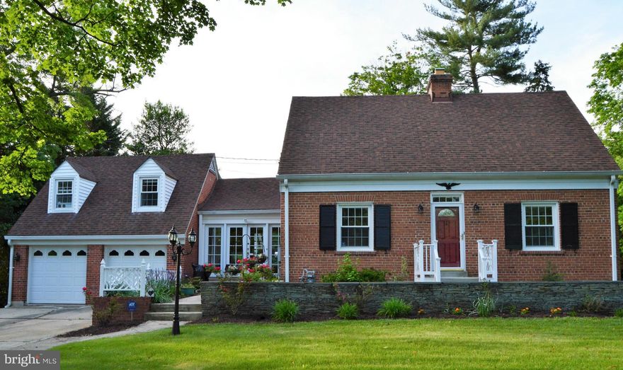 Wonderful home with upgrades galore & fresh paint.  This home sits on just over an acre lot.  The kitchen and baths have been updated, the stunning fireplace now has gas, the hardwood floors glisten, there is a 4th bedroom complete with bathroom over the garage and it is a legal apartment, if one selects to use it that way.  Just  minutes to the ICC..  SQ footage in error Total LA 2352 ESt.