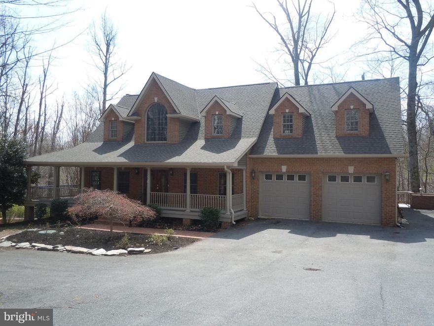 Discover this magnificent, four sided brick cape cod on nearly three wooded acres, close to most everything yet away from the maddening crowd.  Stain grade oak trim and solid core doors, hardwood and LVP flooring throughout.  Solid surface kitchen counter tops with stainless steel appliances.  Lots of windows and natural light.  Rockaway on the deep, covered front porch.  2-car attached garage and 2 car detached garage with a spacious one-bedroom apartment above (would make a great Airbnb or rental).  Large main level home office with its own private entrance.  Upper level loft/living area, loads of closet space and storage, huge lower level recreation room overlooking the rear grounds and leading to the spacious indoor, heated, saltwater swimming pool, perfect for parties and family events.  Abundant decking & patio space for outdoor entertaining.  If you seek privacy and tranquility that is not too remote, this is a property you must see!