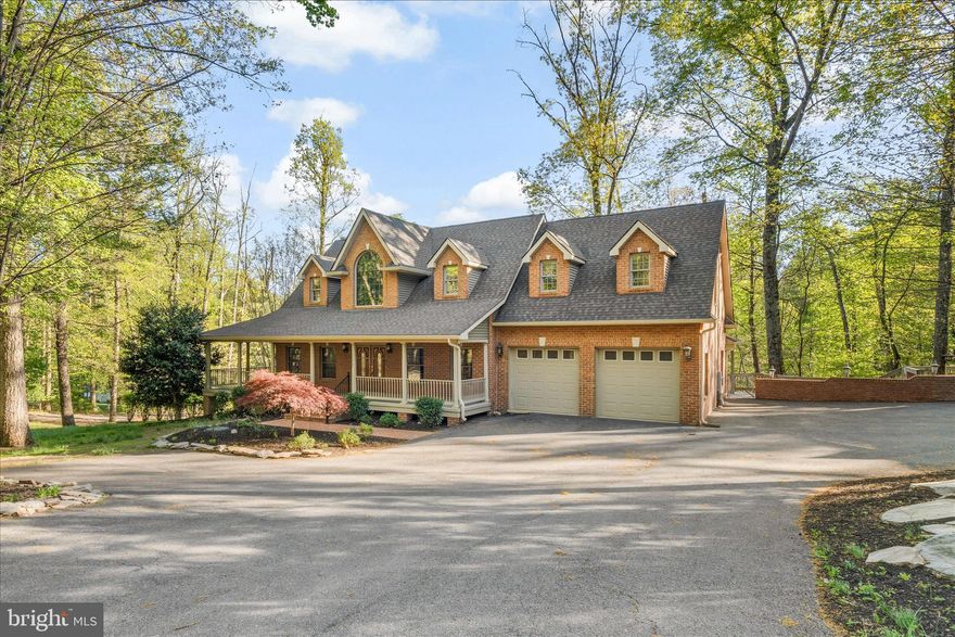 Discover this magnificent, four sided brick cape cod on nearly three wooded acres, close to most everything yet away from the maddening crowd.  Stain grade oak trim and solid core doors, hardwood and LVP flooring throughout.  Solid surface kitchen counter tops with stainless steel appliances.  Lots of windows and natural light.  Rockaway on the deep, covered front porch.  2-car attached garage and 2 car detached garage with a spacious one-bedroom apartment above (would make a great Airbnb or rental).  Large main level home office with its own private entrance.  Upper level loft/living area, loads of closet space and storage, huge lower level recreation room overlooking the rear grounds and leading to the spacious indoor, heated, swimming pool, perfect for parties and family events.  Abundant decking & patio space for outdoor entertaining.  If you seek privacy and tranquility that is not too remote, this is a property you must see!  Only 1.5 miles from the city limits, yet worlds away.  Close to shopping, schools, employment opportunities, places of worship, medical facilities, commuter routes and recreational pursuits.