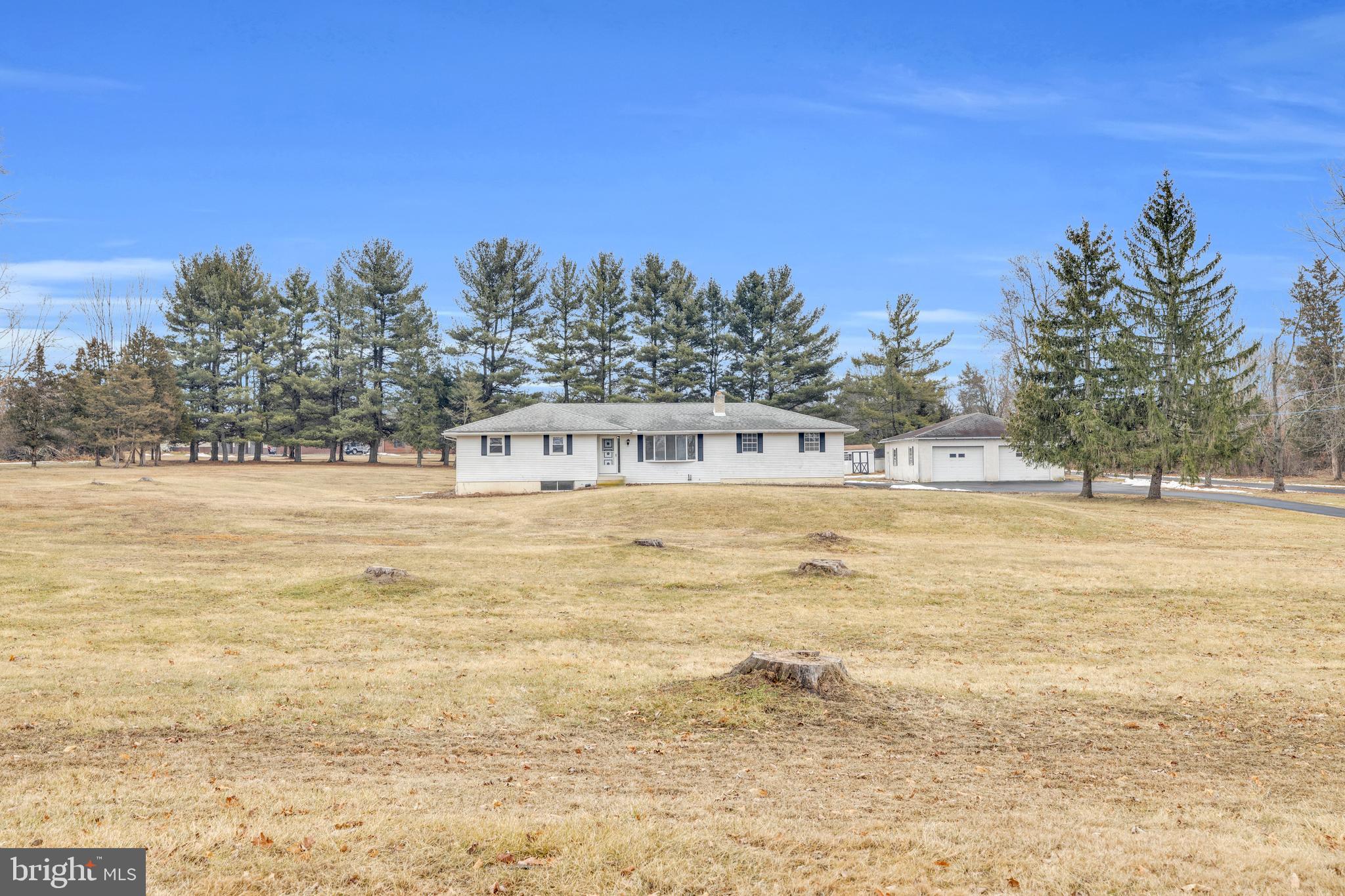 Welcome to 2444 Gramm Road, Pennsburg, PA—your dream home with room for all your hobbies and passions! This sprawling ranch-style home is set back from the road on over 2.3 acres, offering both privacy and space. Whether you have extra cars, need room for your toys, or run a business, this property has you covered with a two-car garage and a massive four-car detached garage, complete with attic storage via a Bressler stair.
Inside, the home welcomes you with a spacious kitchen and dining area, new range, new dishwasher, and luxury vinyl plank flooring that extends throughout the main level. The living room is a cozy retreat with a wood-burning fireplace and stunning views of the expansive front yard.
Down the hall, you'll find three comfortable bedrooms, a full hall bath, and a half bath conveniently attached to the primary bedroom, both baths now with new vanities and new flooring being installed. The newly carpeted lower level opens into a bright, expansive room, perfect for entertainment or relaxation. Step outside onto the brand-new pressure-treated deck, ideal for hosting gatherings or simply enjoying the serene surroundings. The rear yard offers potential for a future pool and play area.
Additional features include a heating system in the garage (not recently used by the seller), a versatile space in the lower level for a future office or play area, a laundry center, workshop, and utility room. This home is the perfect blend of comfort and functionality, ready to accommodate your lifestyle. Don't miss out on this incredible opportunity. Note: The detached garage is 40' deep by 32' wide with 8 ft high garage doors.