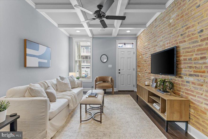 Stunning renovated brick rowhome in the heart of Federal Hill, showcasing high end finishes throughout. This beautifully updated home features exposed brick walls, recessed lighting, crown molding, and gleaming hardwood floors. The gourmet kitchen is a chef’s dream with granite countertops, stainless steel appliances, and a spacious dining area. Upstairs, the primary suite offers a luxurious spa like bath, along with a second bedroom and full bath. The finished lower level includes two additional bedrooms and a full bath, perfect for guests or a home office setup. Enjoy water views from the rooftop deck, ideal for relaxing or entertaining. A true gem in a prime location!