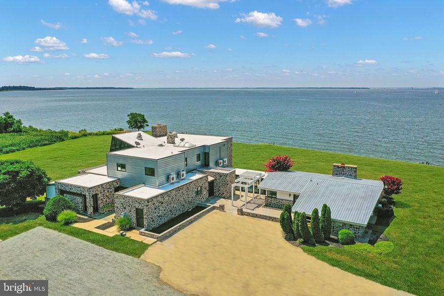 Wake Up with Breathtaking Sunrises and Close Your Day with Colorful Sunsets in Your One of a Kind Chesapeake Bay Custom Contemporary Waterfront Home on a Very Private 4.67 Acre Lot !   Newly Renovated with an Eye for Entertaining, You and Your Guests will Enjoy the the Dramatic Lines, Walls of Windows, Panoramic Views and Open Spaces That will Easily Accomodate Large and Small Gatherings.   This 8140 SF,  6 Bedroom, 5 Full Bathrooms and 2 Half Bathroom will Easily Sleep 16 People.  The Main House has a main level Primary  Bedroom with Ensuite Bath and Private Patio, Upper Level Primary Bedroom with Sitting Room and Ensuite Lavish Bath, A Guest Room with Ensuite 1/2 Bath and then a Bunk Room with 4 Built In Bunks!  The Attached Guest House has a Second Kitchen, Living Room, Guest Bedroom and Then Bunk Room with 4 Bunks Again.  This Home Can Be Accessed with Private Entrance or Via Spacious Foyer.  Nestled on 4.67 Private Acres with 900' on the Chesapeake Bay, this Estate Is  Perfect   For Family /Extended Family  or Weekend Retreat with Entertaining and Guests.   Yes....You Do Deserve This.  Schedule Your Tour Today and Experience the Chesapeake Bay .