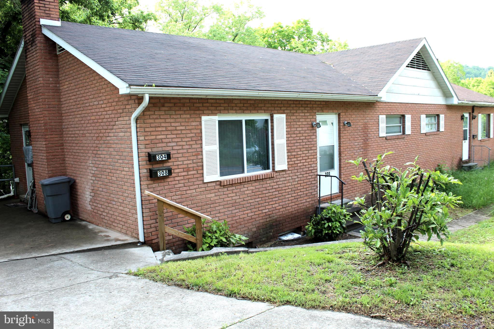This is an income producing investment property in the heart of Berkeley Springs. with a long term tenant in place. The duplex building has one 2-bedroom apartment upstairs (unit 308) and one 2-bedroom apartment downstairs (unit 304). Off street parking for each apartment conveys with sale; the downstairs unit has a detached covered area. Its central location is perfect for an office space - use yourself or rent it to someone else. First time property owners can live in one apartment and rent the other so you can build equity for future purchases. It is within easy walking distance to Berkeley Springs State Park and spas, downtown shops and restaurants, the Star Theater and the Morgan Arts Council ICE House artists co-op, so it could function as a vacation rental and, later, a future home for retirement. Extra storage is provided by a brick storage shed in the back. The property is sold As-Is.