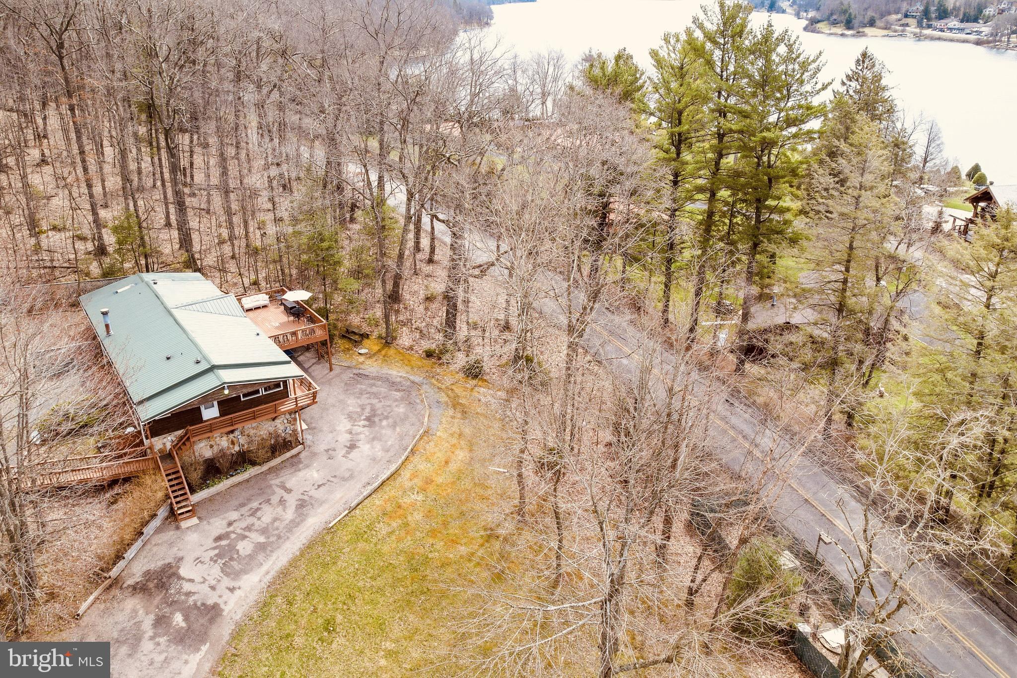 Centrally located 3br 2bath established short term rental on Rock Lodge rd with filtered lake views.