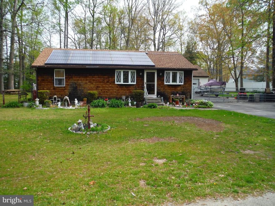 Rancher on 1.09 Acre Private Lot. Adjacent .75 Acre Lot across driveway is included in sale as well (2909 Willoughby Beach Rd- Tax ID 1301393219). Public water and sewer hookup available for adjacent lot.  Overall lot is 1.75 acres, flat and mostly cleared. Trees add privacy from surrounding subdivision. Backyard is fenced. Property includes 36x32 oversized detached garage perfect for a workshop. Home features 2 bedrooms and 2 full baths. Hardwood floors in living room and kitchen. Save money on your electric bill w/ leased solar panels through Vivint which are transferable to new owner. Porch off Master Bedroom. Furnace only 2 years old. Schedule your showing now!