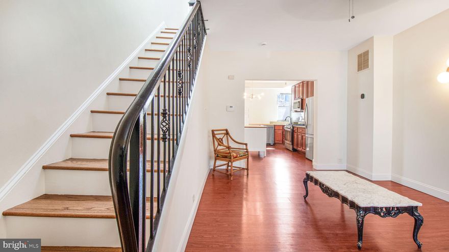 *Motivated Seller* Price Reduced* - Welcome to this must-see home!! Fabulous end-of-group 3 bdrm, 2 full bath townhouse in Waverly. This beauty is ready to move-in for you to start your next chapter! Walk up newly restored concrete steps, enjoying your freshly mulched local pollinator garden, up to your large covered front porch. Step inside to discover a thoughtfully designed interior that seamlessly combines comfort and style. Large windows and high ceilings fill the space with natural light, highlighting the home's warm and inviting atmosphere. Walk through the large living room to a bright, eat-in kitchen/dining room combo with new island. Newish cabinets & countertops with 0-2 year appliances, so you have little to worry about once you move in. Behind the kitchen, you’ll find a beautifully renovated full, main-floor bathroom. A little further is the new Energy Star washer/dryer laundry area. The upper level boasts three ample-sized, well-lit bedrooms and another fully renovated bathroom. The entire house has just been painted and the brand new upstairs flooring and staircase really shines. The unfinished lower level is tall enough for a potential living space, another full bathroom and/or much needed storage. Easy rear access from the basement to the backyard. With southern exposure and bamboo privacy fencing, the backyard provides a perfect place for sunny entertaining or relaxing. Central A/C, and many new upgrades, this property is a uniquely solid house in a great location. Boasting a walk score of 95 and bike score of 87, this is what urban living is all about. So convenient to Waverly YMCA, Library, Bus Routes, Hopkins University, Morgan State, Towson, downtown, bike routes, I83, 695, the location is incredible!!  Come and see the possibilities!!