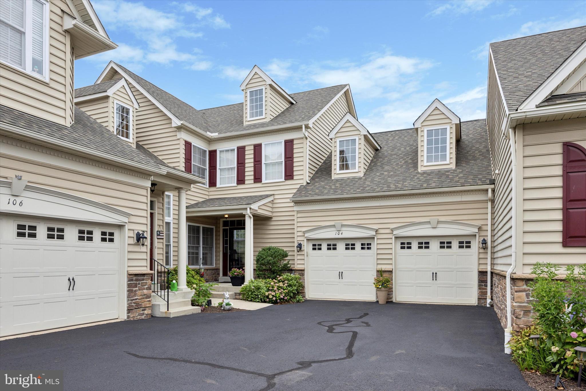 Welcome to 104 W Kennedy Rd in the beautiful Montgomery Walk 55+ This Canterbury model corner unit is largest floor plan in the development. The location is the best anywhere, close to all the shopping and restaurants along Rt309, easy travel to anywhere, and within the community on a very private lot. The community centers around the clubhouse with it's stunning pool and space for activities to suit everyone including swimming pool, tennis, putting green, craft room, theater, billiards, library, cards, and just a great room , perfect for parties or just another place to meet and chat with your neighbors.
Enter into #104 from your front door, or just glide into the garage and go inside from there, avoiding the weather! Entering into the foyer you will notice the pristine hardwood floors, an elegant stairway to the second floor, and access to the huge, basement with high ceilings, just waiting to be finished! The second bedroom (currently used as a playroom for the grandchildren) is off the foyer, plus a full bath. A few steps lead you into the stunning great room with a two story wall of windows and a fireplace. Always filled with great light, this is an awesome space! The great room is open to the dining room which has sliders to the oversized deck. The dining room is open to the kitchen which has a large island with seating and a plethora of cabinets with pull out shelving, soft close doors, and stainless steel appliances. It also has a pantry! The laundry room with extra storage is just here, which leads into the garage.
The owner's suite is again full of light. A spacious bedroom with windows on two sides, a spa-like bathroom with a soaking tub and a large separate shower and double vanity. Two walk-in closets round out the owner's suite.
Go upstairs from the foyer to the spacious loft area with an elegant railing overlooking the great room, On this level is the 3rd bedroom with a walk-in closet and a full bathroom, which is also open to the gallery area overlooking the great room.
The HOA covers every thing in the development outside the home: exterior siding and painting, roof, staining the deck, snow removal right to your door, road maintenance, landscaping, clubhouse, pool, tennis courts and putting green.
Make your appointment today!