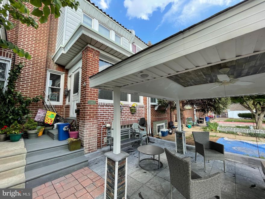 Welcome to this well maintained 2sty straight-thru row home!  From the front manicure lawn you will see a beautiful water fountain, walk up the new steps to the stunning 5Yrs. New Pavilion with a beautiful water fall and a linear gas fire pit.  Enter the home to the relaxing Sunroom, then spacious living room w/hardwood floors, formal dining room and a modern eat-in kitchen.  Upstairs feature three spacious bedrooms with ample closet space and a 3pc. Modern hall bath.   The lower floor features additional storage space, laundry area & inside access to the large attached rear garage. Property is conveniently located, close to shopping & public transportation.  Easy to Show! Schedule your showing today!!!