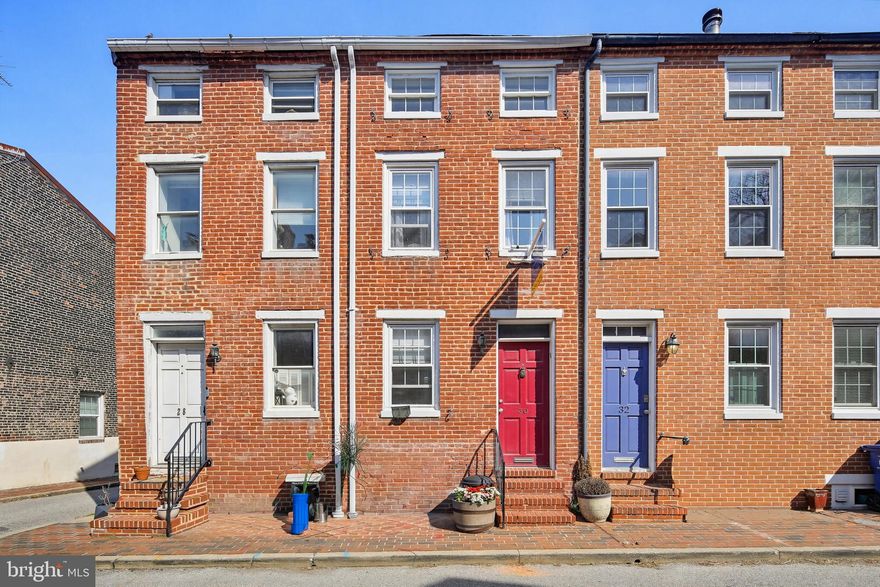 Welcome to this classic 2 bedroom brick row home, where historic charm meets modern comfort. Sited on a quiet street, within walking distance to fabulous amenities, this home is filled with original character and timeless appeal. Original hardwood flooring on 3 ample levels of living space, a woodburning fireplace, upgraded kitchen with stainless/granite/breakfast bar, spacious primary bedroom with built-ins, landing large enough to be a home office or sitting room, full tiled bath with built-ins, and an amazing loft/2nd bedroom with skylights: this home offers unique features on all levels. The patio, located off of the kitchen, adds living space and is perfect for entertaining and relaxing.
This home offers a manageable footprint that allows you the opportunity of enjoying Federal Hill and our wonderful city!