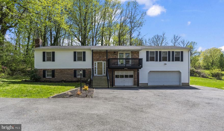 Welcome to this expansive 3BR, 3BA split-foyer in Chesapeake Beach! The light-filled upper level boasts a seamless flow between the living area and an updated kitchen with granite countertops and stainless steel appliances. Step into the stunning sunroom off the kitchen—your private sanctuary for morning coffee with views of the fully fenced-in backyard that backs to trees! The finished lower level features a classic brick fireplace with a pellet stove insert, a bar area, a full bathroom, and additional space for a hobby room, access to the garages, etc!  Great location! Minutes to the Chesapeake Beach Resort & Spa, marinas, boardwalk, Bayfront Park, and local dining. Enjoy the best of the beaches, shopping, and waterfront lifestyle right at your doorstep!