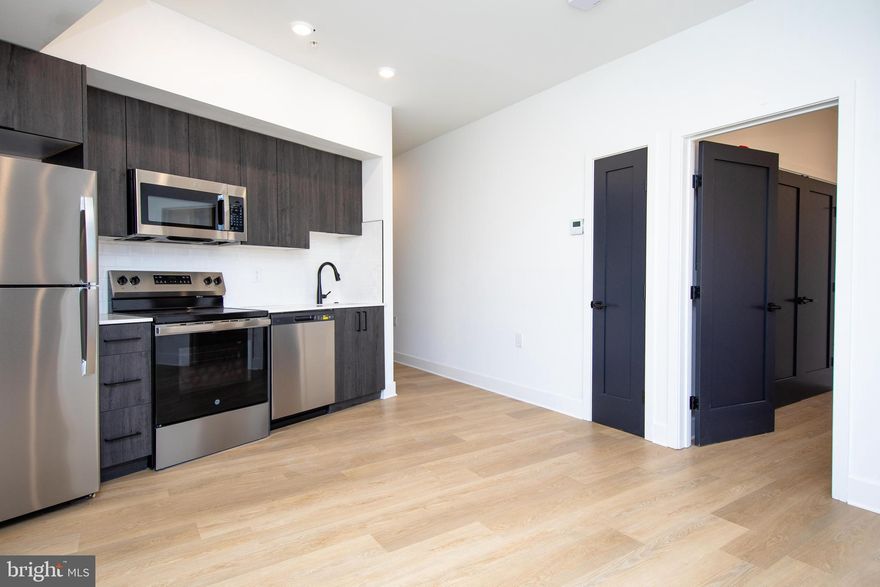Discover modern city living at its finest with this brand-new one-bedroom apartment in the newly constructed Dosa Flats building, located in the vibrant heart of Northern Liberties. This spacious unit is flooded with natural light, enhancing its contemporary design. Inside, premium appliances—including an in-unit washer, dryer, and dishwasher—are provided for your convenience and comfort. Enjoy added peace of mind with controlled building access and large, energy-efficient triple-pane windows that keep city sounds at bay. Designed as a smart apartment, you can open the door and change the thermostat temperature from your phone. Fresh air intake ensures continuous ventilation in every unit. For added convenience, five secured, exclusive parking spots are available for an additional $300 per month—ideal for urban dwellers. You are just steps away from the lively dining, shopping, and entertainment that Northern Liberties has to offer, including local favorites such as Yards Brewing, Silk City Diner, Federal Donuts, Honey’s Sit ‘n Eat, and Franklin Music Hall, to name a few. This apartment is the ultimate blend of style, security, and location. Don't miss the opportunity to make this light-filled unit your new home—schedule a tour today!
There are incentives for a two-year signed lease.