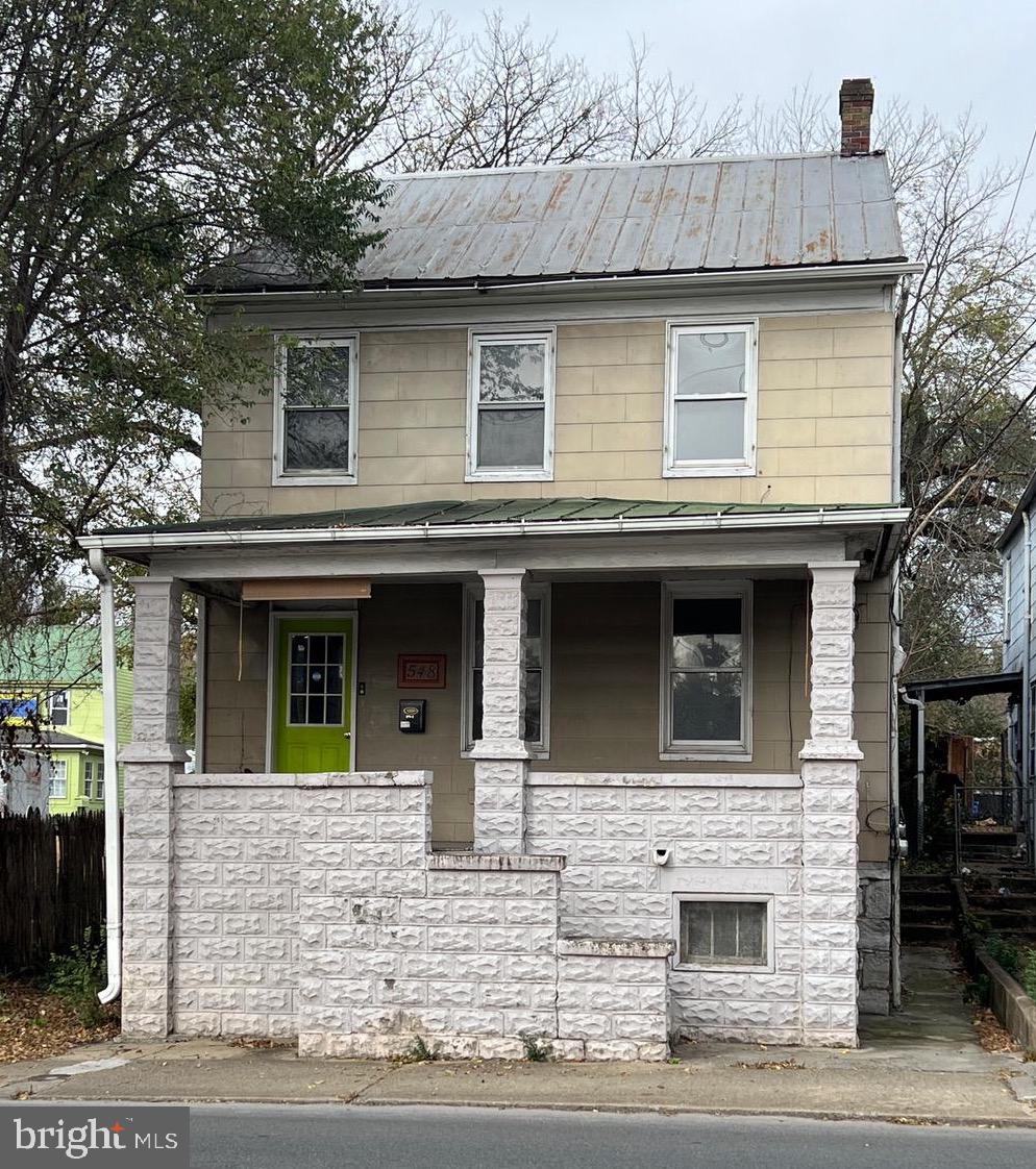 “Double on Queen” - See the potential! This duplex has opportunities for an investor to polish and refurbish in order to become an income producing property. The first level provides front and rear entrance, one bedroom, one bath, a living space, a kitchenette, and a mud room area. The second level provides a large kitchen, open living space, one bedroom, one bathroom, and a walk-in closet. You’ll find the first level needs more TLC than the second level. The front porch adds a nice touch for either unit to share. And the backyard is spacious with a rear alley for parking access. Come see for yourself. Being sold as-is. Won’t last long!