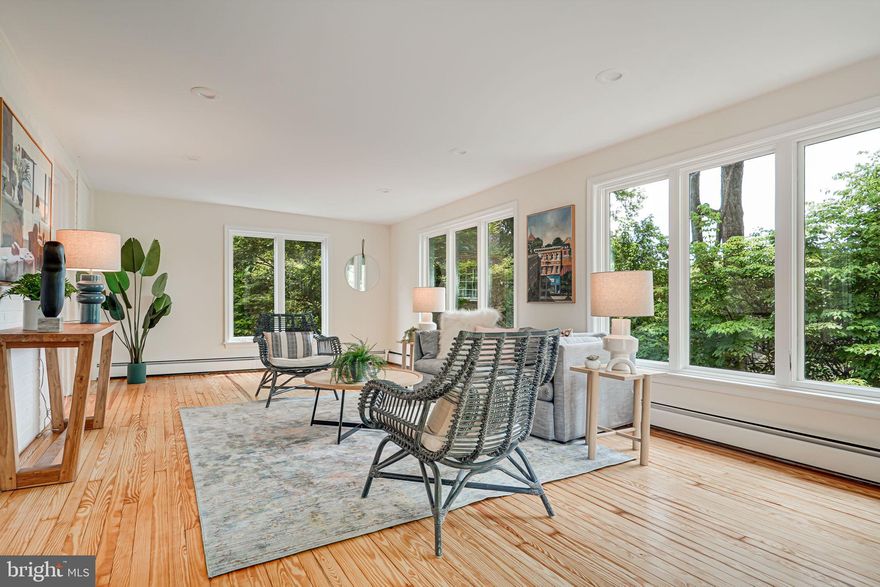 This stately seven-bedroom, four-and-a-half bath home located in the heart of Glen Echo Heights offers 4,500 square ft of living space. Featuring gorgeous hardwood floors throughout, enter the expansive first floor with two dedicated living spaces - one with a cozy fireplace and the other, a beautiful tree-lined, sun-filled room to enjoy the western sunset exposure. Enjoy dining with guests in the spacious dining room or eating more casually in the eat-in kitchen. The updated kitchen presents top-of-the-line, stainless-steel appliances, with plentiful cabinet and countertop space featuring an island and separate coffee or pantry-alternative. The attached garage sits directly near the kitchen creating easy access without a hassle. Walking up the grand staircase to the second level, you’ll find four spacious, window-lined bedrooms. The primary bedroom includes an ensuite bath and expansive walk in closet. The third floor is pretty magical - you feel like you’re in a treehouse, yet have two substantial spaces for bedrooms, office, or living/flex space, a full hall bath, and extra, insulated storage. Downstairs is a fully-finished lower level, which includes a living/play space with a fireplace and direct walkout to a private patio, an extra bedroom and full bath, and a full laundry room. Great for guests or extra living space! The lush green yard is perfect for entertainment or relaxation. Recent thoughtful updates include an HVAC unit as part of the home’s dual HVAC system, a tankless hot water heater, a premier refrigerator and double oven, double-paned windows, refinished hardwood floors, and the entire home has been freshly painted. This quiet but accessible neighborhood offers pools (Mohican Pool Club and Bannockburn Swimming Club), parks, shopping centers (Sangamore Shopping and newly developing Westbard Square), and more. Sitting in the perfect location for a quick trip into DC but also close to Clara Barton parkway to get into VA or farther MD. The close proximity to MacArthur allows for running, walking, and hiking trails and the nature-filled canal towpath. Offer deadline of Tuesday at 11am.