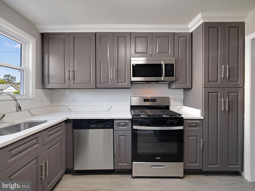 Welcome to this beautiful  End unit Townhome featuring 3 bedrooms and 1.5 bathrooms with  spacious living on 3 finished levels. This updated End Unit showcases contemporary finishes and a thoughtful layout that maximizes both style and functionality. The custom kitchen with quartz countertops, and appliances will enhance your cooking experience. Complete with a traditional floor plan and modern finishes that will WOW you the moment you walk through the door. The bathrooms have been tastefully refreshed adding elegance to this classic Colonial style townhome, New Laminate flooring and carpet installed throughout.This home boasts an array of high-end finishes and amenities. freshly paint, and much more. . . Extend you entertaining to the fully  finished basement with recessed lighting or outside for the cookouts in the  spacious backyard. Close to major major hwys, grocery stores public transportation and park areas, . Great homes do not last long in this market, so hurry !!