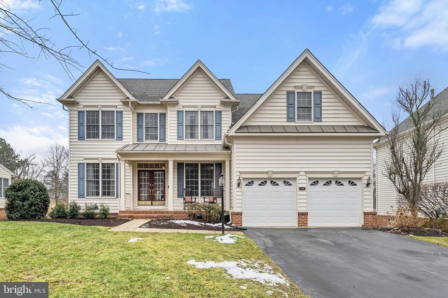 EXCEPTIONAL OPPORTUNITY to own 5BR/3.5 Bath HOME in Haymarket’s COVETED Dominion Valley Country Club’s Resort Community!   These ORIGINAL OWNERS loved this home and it SHOWS!  Freshly Painted and Loaded w/ CUSTOM CROWN Moulding, Window Framing, and Shadow Boxing.  The recently RENOVATED & STUNNING Eat-In Kitchen w/ Greenhouse Option has DESIRABLE white cabinetry, NEW Black Soap Stone countertops, ISLAND with food prep sink and PRACTICAL 2nd Dishwasher, SUPERCUTE Farm House Sink, 5 Burner Gas Cooktop, Wall Oven/Microwave Combo, and New SS Samsung Refrigerator, and multiple food PANTRIES.  This VERY POPULAR Floor Plan by Toll Brothers has been CUSTOMIZED with 2nd PRIVATE Main Level Study w/ French Doors.  Perfect for multiple family members teleworking, a virtual learning center, or hobby room.  Formal Dining Room, Main Level Library with Built-Ins.  New 6x24 Wide Plank Distressed Tile Floors cover most of the Main level living areas.  The GRAND 2-STORY Great Room is OPEN to the Kitchen includes a Gas Burning Brick Fireplace (can be converted back to wood) w/ Mantel and Dual Ceiling Fans.  DESIRABLE Outdoor Living; Walk-out to your SPACIOUS Maintenance Free TREK Deck connected to a Stone Patio and Fire Pit.  Plenty of yard space for the little ones to PLAY on the PLAY-SET (conveys).   Property backing to tree line and Arnold Palmer Designed Championship Golf Courses 3rd Hole.  The ARRIVAL Room with Washer and Dryer includes Built-In LOCKERs for book bags and coats.  The UPPER LEVEL living quarters includes 4 GENEROUS sized Bedrooms and CLOSETS.  Supersize Walk-In-Closet since 2-story FOYER removed.  The UPPER LEVEL Bath was completely REMODELED (2018) with NEW Frame-less Shower, Dual VANITY and Flooring. The PRIMARY Bedroom has a ship-lap statement wall w/  SUPER CUTE Sliding BARN DOOR  leading to Office or Private Retreat.  Primary Bath has RELAXING Jacuzzi Tub, Separate Shower, Dual Vanities, and Water Closet.  The Finished WALK OUT basement with FULL SIZE windows includes INVITING 7.1 Home Theater w/ Built-In Speakers, 100” Fixed Mount Screen and Projector (Equipment Conveys) w/ Multi-Tier Seating, Large Rec Space, Play Area, 5th Bedroom and FULL Bath.  Wet Bar Plumbing Stubbed for Future Addition.   Buyer PEACE-of-MIND: ROOF (2018), 2 new HVACs Replaced (2019), Water Heater only 5-7 years old.  YOU DO NOT WANT TO MISS OUT on this OPPORTUNITY!