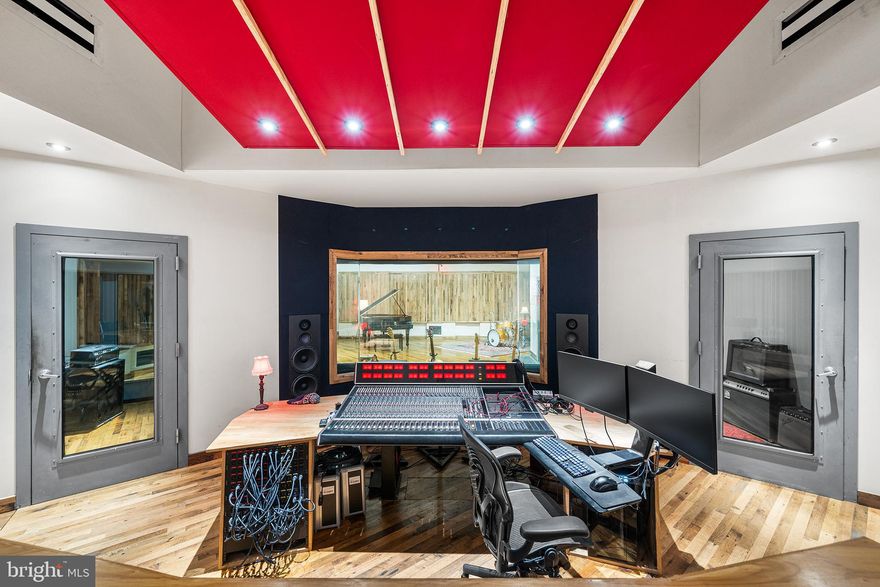 Welcome to an ULTRA rare opportunity to acquire a fully built, state of the art recording studio paired with a design-forward residence in the heart of Fishtown. The property is home to Spice House Sound, a turnkey recording studio designed by the Walter Storyk Design Group, the world-renowned firm behind iconic studios across the globe, including Electric Lady Studios in New York City. The sprawling studio space was meticulously built and optimized at every stage for professional recording and production and is fully operational today. The sale includes all studio contents and naming rights, encompassing an extensive collection of vintage and modern instruments, microphones, outboard recording gear, computers, mixing board, and studio furniture (see attached itemized list of full inclusions in MLS docs), allowing a new owner to step in and operate immediately. The studio is directly connected to a three-bedroom residence via the studios private kitchenette and bathroom, creating a seamless live/work environment for an owner/operator while maintaining functional separation between uses. The residence can also be used to allow musicians and engineers to stay onsite during recording sessions in the attached three bedroom home. The living quarters are spread across two floors, featuring one full bath and two half baths, a stylish kitchen, garage parking, and a dramatic living room with vaulted ceilings and a skylight, filling the space with natural light and volume rarely found in urban residences. Located in the center of Fishtown, in a former horse stable, the property is fully walkable to the neighborhood’s most sought-after destinations, including Riverwards Produce, Kalaya, Suraya, Reanimator Coffee, and many of the area’s best dining, retail, and cultural offerings. Whether utilized as a creative headquarters, live/work residence, or a fully turnkey studio investment, this property offers an irreplaceable combination of world-class studio design, residential comfort, and premier location. Do not miss your opportunity to be the next stewards of this incredible Fishtown property.