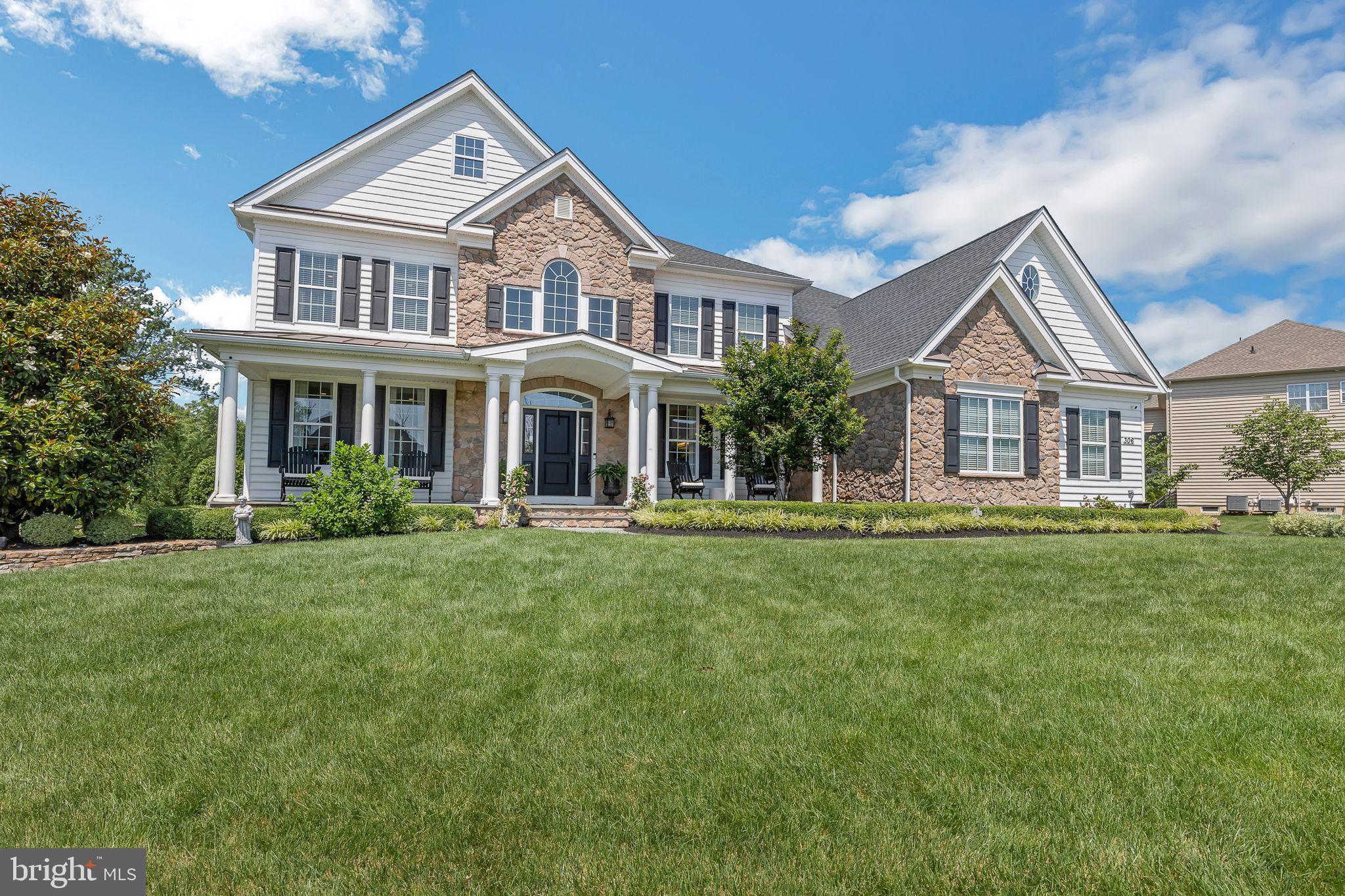 *OFFER DEADLINE @ 12 PM (Noon) on Sunday, 6/29/25* Welcome to 306 Rowland Lane, situated on a half-acre of manicured grounds, in a premium cul-de-sac location, within the exclusive enclave of New Britain Woods. An elegant blue thermal flagstone walkway greets guests and leads to a deep front porch, enhanced by an aspen fieldstone veneer skirt, step side walls, and elegant stately columns. An impressive two-story foyer entry is flanked by dual butterfly staircases, custom closets, and the living and dining room areas—each featuring upgraded moldings. Just beyond the foyer, the family room is complemented by a gas fireplace and custom woven wood shades, striking the perfect balance between comfort and class. An abundance of natural light from double glass doors and triple windows fills the breakfast room and expansive kitchen. At the center of the space, an oversized Silestone Quartzite island in Pearl Jasmine with corbels is complemented by 3 pendant lights; custom cabinetry with slow-close doors, stainless steel appliances, stone tile backsplash, Sub-Zero refrigerator, gas stove, Asco dishwasher, and a custom pantry with shelves & wire pullout storage bins make this kitchen an absolute dream! A convenient third set of stairs to the second floor can be found adjacent to the breakfast area and family room. The main floor study with French doors, a well-appointed half bathroom, and a large mud room off the garage entry with custom built-in organizational shelving complete the main level. Upstairs, step through elegant double doors into a luxurious primary bedroom retreat featuring a tray ceiling and gleaming hardwood floors that flow seamlessly into a sophisticated office or reading nook, complete with custom-built-ins. Automatic room-darkening blinds create the perfect ambiance, and the spa-inspired primary bathroom boasts dual vanities, a private water closet, and a sleek stall shower. The primary closet is a masterpiece, equipped with a custom closet system, decorative lighting, abundant shoe cubbies, and extensive shelving for effortless organization. Each secondary bedroom is thoughtfully designed with rich hardwood flooring and elevated finishes. Two bedrooms share a Jack-and-Jill adjoining bathroom with a tub-shower combo, while the other two bedrooms feature private en-suite bathrooms. All bedrooms include custom closet systems for optimal storage and style. An additional 1200+ square feet of finished basement features CoreTec Newport Oak flooring, recessed lighting, built-in media center, French doors to the gym, an additional office or craft room, and an unfinished space for excess storage. Outside, an impressive, tiered paver patio with built-in gas grill, gas fire pit, pillar lighting, and LED step lighting enhances the secluded rear yard, complemented by a 54” black Jerith aluminum fencing. A 3-car garage is heated and features a remote-controlled ceiling storage rack, closets, tool area, shelving units, and rack organization system. Additional upgrades include custom window treatments throughout, security system, lawn sprinklers, hardwood floors throughout the majority of the home, meticulous landscaping (pear trees, Leyland cypress trees, Kwanzan cherry trees, Green Giants, boxwood, liriope, hydrangea), and so much more! See list of upgrades made during the original owner’s tenure. This special property adjoins open space featuring a walking path and pond with water fountain. Easy access to Rt. 202, Rt. 309, R5 SEPTA Train, & PA Turnpike and conveniently located close to shops, dining, community events, & nightlife in Chalfont, New Britain, & Doylestown Boroughs. Hiking, kayaking, fishing, and so much more can be found at Peace Valley Park/Lake Galena just a couple miles away. Schedule your appointment today!