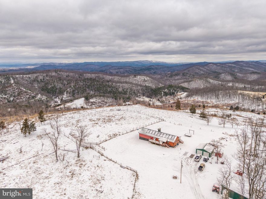 Set atop 102 ± acres of scenic Appalachian countryside, this exceptional property offers a rare combination of privacy, functionality, and sweeping mountain views. A well-appointed 2,100+ square foot home anchors the land, perfectly positioned to take in panoramic views of the Appalachian Mountains from both the front and back porches—ideal for sunrise coffees and sunset evenings. 
 
Originally built in 2002, the home was significantly expanded in 2022, nearly doubling its original square footage to create a comfortable and versatile layout. The residence features three bedrooms and two full baths, along with central air conditioning, solar power, and an outdoor wood stove, providing both modern convenience and energy efficiency. The thoughtful blend of traditional construction and recent upgrades makes the home well suited as a full-time residence, working farmstead, or recreational retreat. 
 
The land itself is highly usable and easy to navigate, with a network of established trails allowing access throughout the property by ATV or UTV. Open pasture areas are fully fenced with high fencing in good condition, making the property ideal for livestock or horses. Multiple ponds provide reliable water sources for animals, and a seasonal spring adds to the property’s natural appeal and utility. 
 
Several outbuildings offer ample space for equipment storage, workshops, or additional utility needs, supporting agricultural use, hobby farming, or outdoor recreation. The mix of open land and wooded areas creates a balanced landscape with excellent views, privacy, and usability. 
 
Outdoor enthusiasts will appreciate the property’s proximity to a wide range of recreational destinations, including Moncove Lake, New River Gorge National Park, the Appalachian Trail, and numerous off-road trail systems. Despite its peaceful seclusion and expansive acreage, the property remains conveniently located just a short drive from Peterstown, providing easy access to shopping, dining, and everyday amenities. 
 
Whether you’re seeking a mountain homestead, a recreational basecamp, or a private retreat with room to roam, this 102-acre Appalachian property delivers space, views, and opportunity in equal measure.