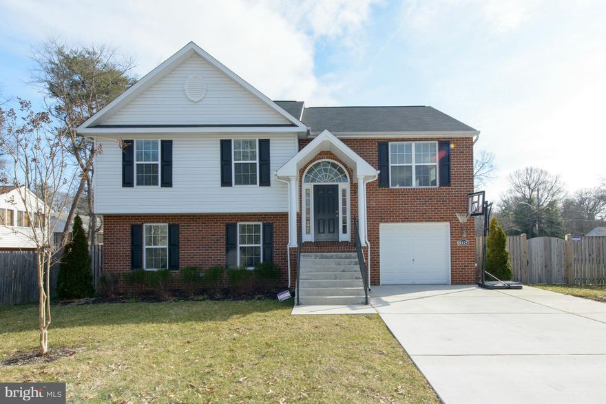 Large kitchen w/ granite counters, upgraded cabinets, and stainless steal appliances.Large master with full bath & double sink + hall full bath.  Large family room in basement/high ceilings.  4th Large bedroom in basement w/walk-in closet; additional full bath. Walkout lower level to enormous fenced backyard.  All the bells and whistles!