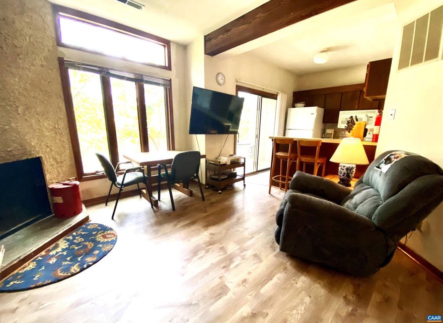 Step into this home and immediately become immersed in the Wintergreen Lifestyle. Walking distance to the Ski Slopes and the entirety of the Mountain Inn Village means your car doesn't have to leave the gated parking area. This condo is renovated and ready, note the LVP, ceramic tile, tankless water heater, new appliances and washer/dryer. Textured walls and fireplace surround with stained beams add to the mountain home ambiance. Walk out on the patio and relax while surrounded by woods and open space or hop on the Highlands Trail to the Wintergarden Spa. Convenience and ease of maintenance make this the perfect spot to land. Act now and make this your home before someone else makes it theirs. Condo fees are only $890 per quarter and WPOA fees are $2279 annually for 2026.,Formica Counter,Wood Cabinets,Fireplace in Living Room