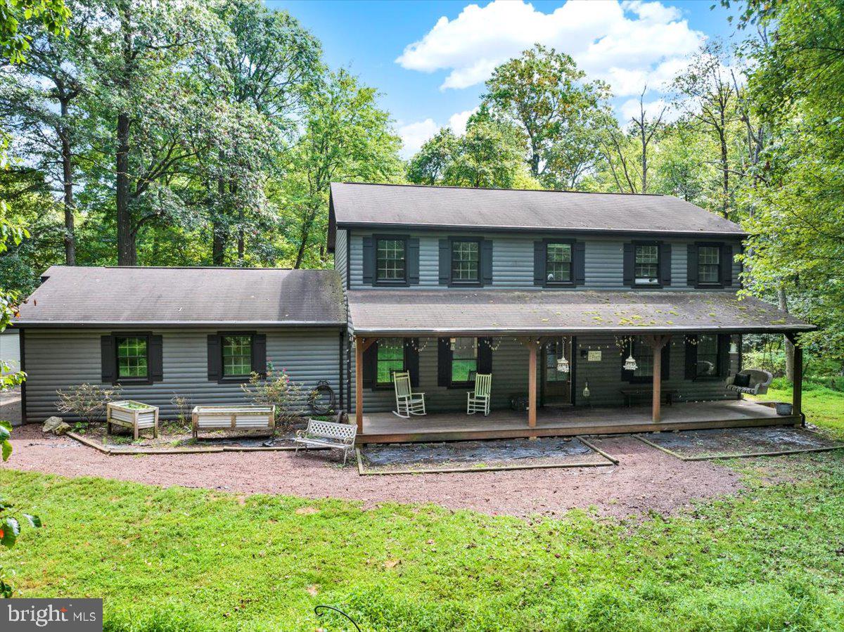 Welcome to your private home and retreat nestled on nearly 2 wooded acres in the sought-after Mountaineer Village community in the Twin Valley School District—With cedar log siding and an abundance of character, this spacious home offers the perfect blend of comfort, style, and function.
Step inside to a smartly designed layout with zero wasted space—every corner features thoughtful storage, and easy flow and so much natural light! The main level welcomes you with durable vinyl plank flooring throughout, leading to a bright and open eat-in kitchen featuring white cabinetry, soft-close dark gray lower cabinets, stainless steel appliances, ceramic tile backsplash, a farm-style sink, and a large pantry. Sliding glass doors from both the kitchen and spacious family room open to a private deck with serene wooded views, perfect for relaxing or entertaining.
The main floor also includes a separate dining room and a flexible living room/home office space/flex space, offering versatility to suit your lifestyle.
Upstairs, you'll find four bedrooms, including a primary suite with an en suite bath, separate dressing area with a sink, a large walk-in closet, and beautiful natural light pouring in from the oversized bathroom window. Warm wood accents add to the thoughtful style choices. A deep hall closet and a full bath complete the second floor. Beautiful Vinyl plank flooring throughout the entire 2nd floor.
The finished basement adds even more living space, featuring a bedroom, full bathroom with brand-new flooring and vanity, flexible living area, and an additional room that could serve as a 6th bedroom or flex space—complete with recessed lighting and charming barnwood and corrugated metal finishes.
Car enthusiasts and hobbyists will love the 1100 sq ft detached 4-car garage, fully equipped with electric and a reinforced bay ready for a future lift. Two separate man-door entrances add convenience. There’s also an attached 2-car garage with a full storage loft above.
Outside, enjoy an outdoor lifestyle with a huge front porch, large fire pit, wooded privacy, and plenty of room for animals, recreation, or relaxation.
This is not just a home—it’s a retreat with stylish upgrades and updates. 1 year home warranty with acceptable offer. Come experience the peace, space, and comfort this special property has to offer.