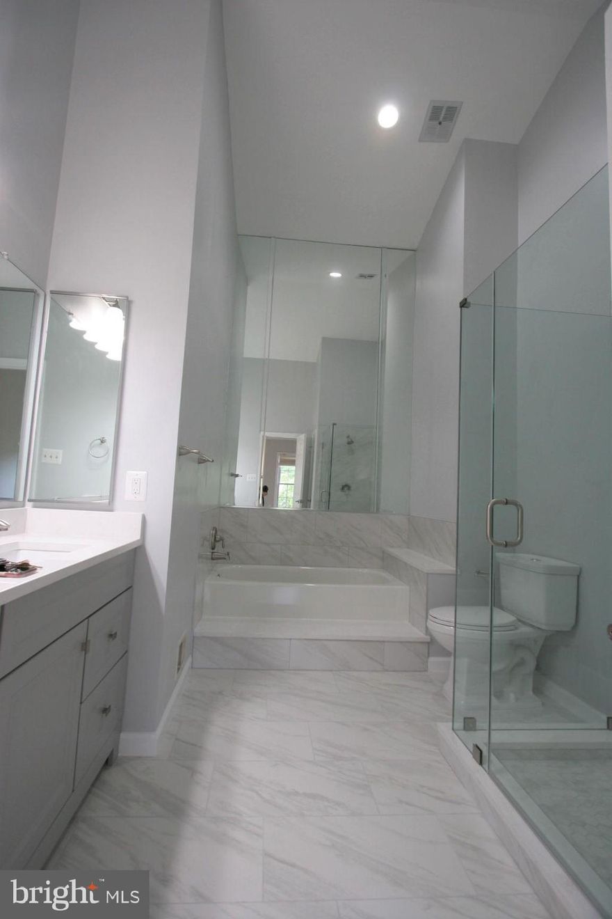 Amazing price adjustment!!   New floors throughout main floor, new sleek master bathroom & a  hallway full bath, new garage door/paint and more!   Well maintained lovely 3 level townhome with 1 car garage.  Bright and open floor plan on main level.  Enjoy nicely designed kitchen and a breakfast area lead to the deck! Spacious master bedroom with a walk-in closet, cathedral ceiling.  A new and upgraded master bathroom with a snow white quartz for vanity top & around bath tub/shower!  High ceiling master bath is a luxious bonus for your new home spa.  Ample visitor parking spaces just in front of the house.  Convenient location to metro access and major roads.   You will love this home!!