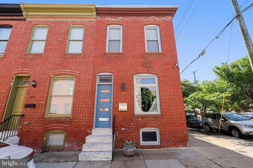 Welcome to 38 North Decker Ave. This end unit row house has it  all with a finished basement, a roof deck, a parking pad, a main level bathroom, and  lots of windows for natural light. The entire home has been meticulously maintained with modern finishes and natural wood tones. Entering through the front door you will walk into the living room and dining area with compliments of hardwood floors and a large window bringing plenty of natural light into the room. Toward the back of the home you will find a half bathroom, the kitchen, and a back door that leads to a private fenced in patio with a gate door to the parking pad. If you travel down the stairs you will find the finished basement with with tile flooring, a full bathroom, bedroom, large storage closets, and laundry. Up the stairs to the second floor you’ll find a well lit staircase with a skylight right above. There is a bedroom to the right and left with a bathroom tucked in the middle. The door to the roof deck is connected to the hallway by the stairs which is convenient for entertaining so that guests do not have to go through a bedroom. This home is located within walking distance to Patterson Park and other neighborhood restaurants and bars. Don’t miss this opportunity to tour this charming home that checks all of the boxes.