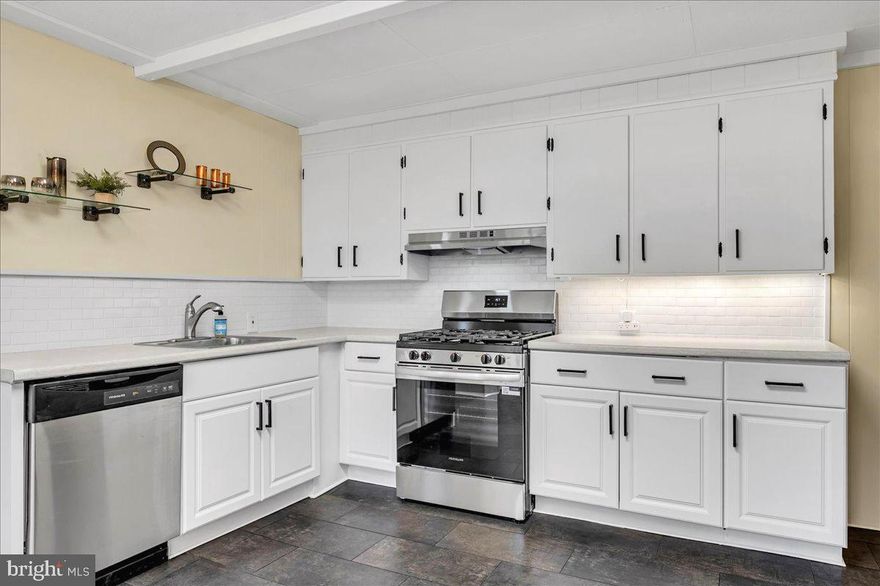 NEW NEW NEW! This charming, updated and move-in ready home is truly one of a kind — featuring a newly sealed private 2 car driveway, large covered front porch, and an expansive, freshly manicured fenced backyard. You’ll immediately be impressed with all of the brand new updates throughout! Natural sunlight pours into the living room upon entry, now enhanced by fresh paint across the entire home and brand-new carpet extending through the living, dining, and upper levels.
The living room is inviting and spacious, with solid wood paneling in mint condition adding warmth and character. The layout allows you to flow easily into the formal dining room through the wide entryway, where a new tiered drum chandelier adds a touch of elegance. There’s ample space to comfortably seat 8–10 guests — perfect for gatherings and entertaining.
The kitchen has been completely transformed with a modern makeover — showcasing new laminate flooring (with 30-year warranty), sleek countertops, ample cabinetry, a subway tile backsplash, and brand-new Frigidaire stainless steel appliances including a built-in dishwasher, five-burner gas range with hood, and large refrigerator with ice maker and water dispenser. The eat-in area features a stylish caged ceiling fan and just off to the side is the spacious pantry. From here, you’ll find access to the mudroom and basement, as well as the main-level full bath, which offers contemporary fixtures and a handicap-accessible shower for convenience.
Step outside from the mudroom to the covered back patio overlooking the expansive backyard — the ideal spot for gardening, grilling, or simply relaxing outdoors.
Upstairs, you’ll find three perfectly appointed bedrooms with brand-new carpet, roomy closets, and updated lighting fixtures all with ceiling fans. The primary bedroom is bright and inviting, featuring a large step-in closet. The hall bath has undergone a beautiful renovation, featuring ceramic tile flooring and walls, a brand-new vanity, mirror, light fixture, and toilet.
The clean, freshly painted and sealed basement provides endless possibilities, offering generous storage space, a built-in work bench with pegboard, laundry hook up (washer included), gas boiler, 2019 hot water heater, and a 100-amp panel with room to expand. — ready for your finishing touches. Sewer lateral inspection and repair done in June 2025, giving you peace of mind for years to come.
Conveniently located with easy access to public transportation, I-95, Philadelphia, Delaware, and New Jersey — plus nearby shopping and dining options — this home offers unbeatable value, thoughtful updates, and modern comfort all in one!
Call today to schedule your private tour and see all the beautiful updates for yourself!