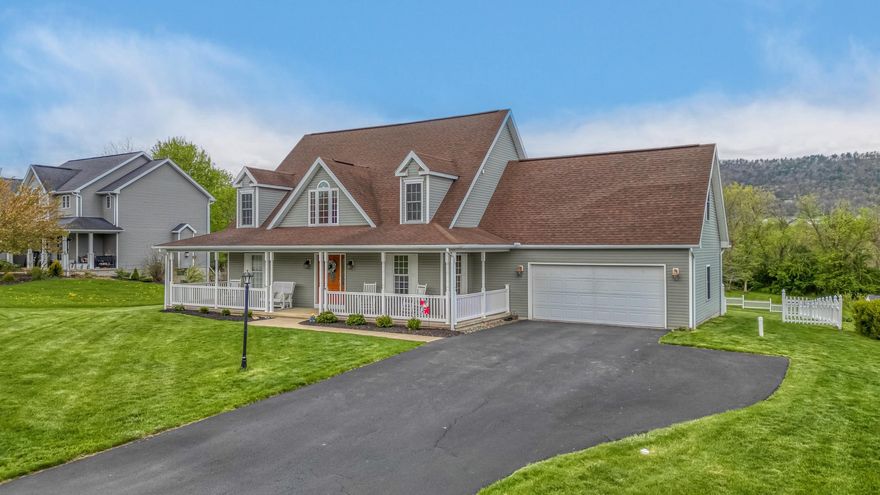 Open House: Saturday May 2, 2:00-4:00 PM .  This exquisitely cared‑for Cape Cod home sits on a beautifully flat and highly desirable lot in Hampton Hills. Its curb appeal is undeniable, highlighted by a charming 5‑foot covered front and side wrap‑around porch with low‑maintenance vinyl railing. The ½‑acre property features a fully fenced backyard with pristine white vinyl fencing, offering exceptional privacy. A delightful 14' x 20' concrete patio invites you to relax, entertain, and enjoy peaceful mountain views as your backdrop.
From the front door to the back, this home feels spacious, bright, and joyful. Hardwood floors flow through the main first‑floor living areas, complemented by LVP in the kitchen and soft carpet in the owner’s suite. The great room impresses with abundant natural light from its soaring 17‑foot ceilings and large windows, along with a warm propane fireplace and classic chair rail detailing. Sliding glass doors lead directly to the back patio for seamless indoor‑outdoor living.

A designated dining room with hardwood floors and crown molding provides an elegant setting for gatherings. The kitchen features quartz countertops, a center island with double sink, generous cabinet and counter space, and newer stainless‑steel appliances. A bay window in the breakfast nook frames lovely backyard views. The laundry room—with utility sink and garage access—is conveniently located just off the kitchen.

The first‑floor owner’s suite is spacious and serene, offering ceramic tile flooring, an oversized vanity and mirror, jetted soaking tub, separate shower, and abundant storage.

Upstairs, a walkway overlooks the great room and leads to three sizeable carpeted bedrooms, a full bath, and a versatile 26' x 9' bonus room perfect for hobbies, play, or additional living space.

The finished lower level expands your options even further with a full bath, a bonus room, and a large carpeted recreation or flex room.

Your days will be delightful and your evenings peaceful in this wonderful home located in a sought‑after neighborhood within the Bellefonte School District—less than 15 minutes from Penn State University. A 2‑car garage with extra storage completes the package.

With approximately 4,000 sq ft of finished living space, this home offers enduring quality, thoughtful design, and room to grow.