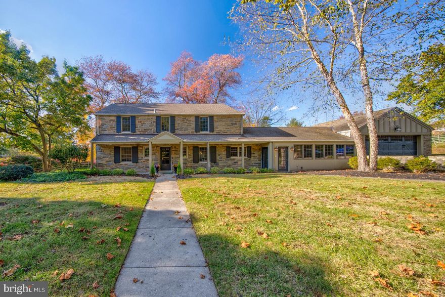 Gorgeous Chestnut Hill Colonial fully restored with charm, character and modern conveniences. This 5 bedroom, 3 full and 1 half bath home with an oversized 2 car garage is located just steps from the Wissahickon Trail and a large corner lot fronting on Waterman Ave. This location cannot be beat! Modern layout with hardwood floors throughout, first floor guest room with full bath (perfect for an in-law or au pair suite), an office/den, butler s pantry area with wet bar and beverage fridge, finished mudroom, covered front porch, open kitchen which leads to the dining room and living room with views to the rear patio and garden. The finished basement offers additional living space, complete with a wine cellar and second laundry room with cabinets and sink. The second level has been completely remodeled to include 2 eloquently done full bathrooms, 4 bedrooms with large closets and a desk nook. Additional features include: Andersen 400 Series replacement windows with full divided light grills and screens, Designer selected Custom Lighting with recessed lights throughout all rooms, Butler s Pantry with Quartz countertop and sink, Sub-Zero Beverage fridge, laundry area for stackable washer and dryer, Covered back patio, Wired cable jacks throughout. Kitchen: UltraCraft White Shaker Kitchen Cabinets with kitchen island including crown molding, Amazing Vent-a-Hood Designer 42  Stainless Steel Hood with Pot Rail, Sub-Zero 36  Panel Ready Refrigerator, Wolf 36  Gas Range with Griddle, Asko Panel Ready Dishwasher, Wolf Microwave in island, Gourmet kitchen island with Quartz overhang to conveniently tuck barstools underneath, Designer selected Quartz countertops with white farm sink, Designer kitchen faucet with spray. Forced central air units in basement and attic for independent zones, Crown Boiler with multi zone controls, Kohler fixtures in bathrooms, Summer winter hookup 50-gallon hot water heater. Designer Selected hardware. All this and more in a convenient location walkable to the shops and restaurants of Chestnut Hill, as well as 2 train stations for an easy commute to Center City Philadelphia, and on street access to Fairmount Park and the Wissahickon Creek trails.