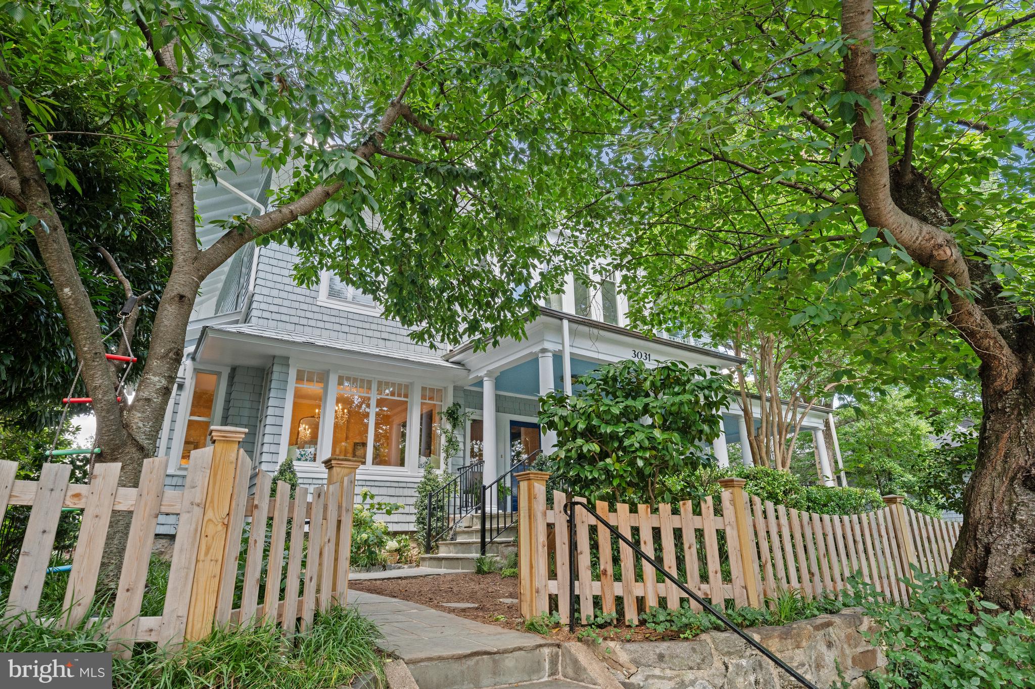 We have pre-inspections taking place. Should you have serious interest, please contact us!
A captivating presence on Cleveland Park's most-cherished street, 3031 Newark Street exudes charm and appeal from its expansive wraparound porch and lovely and private surrounding gardens to its open, airy interior characterized by large rooms with many period details preserved and serene, leafy views from every window.
The main level of the home boasts a gracious foyer, formal living and dining rooms-each with its own fireplace-and a sunlit kitchen with breakfast area that opens to an inviting family room. This home offers exceptional social flow to its multiple outdoor living spaces, including the expansive wraparound porch and flat yard/garden areas. Upstairs, the second level features a light-filled space for seating or an office, a spacious primary suite complete with sitting room, a dressing area, and an en suite bath, plus two bedrooms and a full bath. The third floor offers versatility with two additional bedrooms, a full bath, a sitting room, and generous storage. The lower level includes a large recreation room, bonus room, full bath/laundry, and access to the attached garage.
Dream Cleveland Park location just steps to favorite outdoor and dining hotspots like Rock Creek Park, Cleveland Park Club, Newark St Dog Park, Tregaron Conservancy, Two Amy’s, Cactus Cantina, Metro and more!
*Note the fireplace flames have been added for effect and do not reflect their functionality*